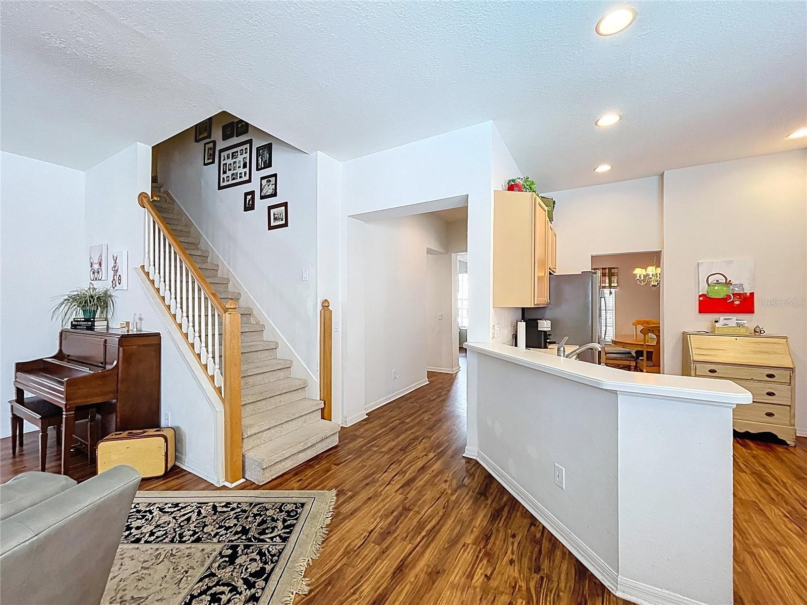 View to kitchen and stairwell from brkfst nook
