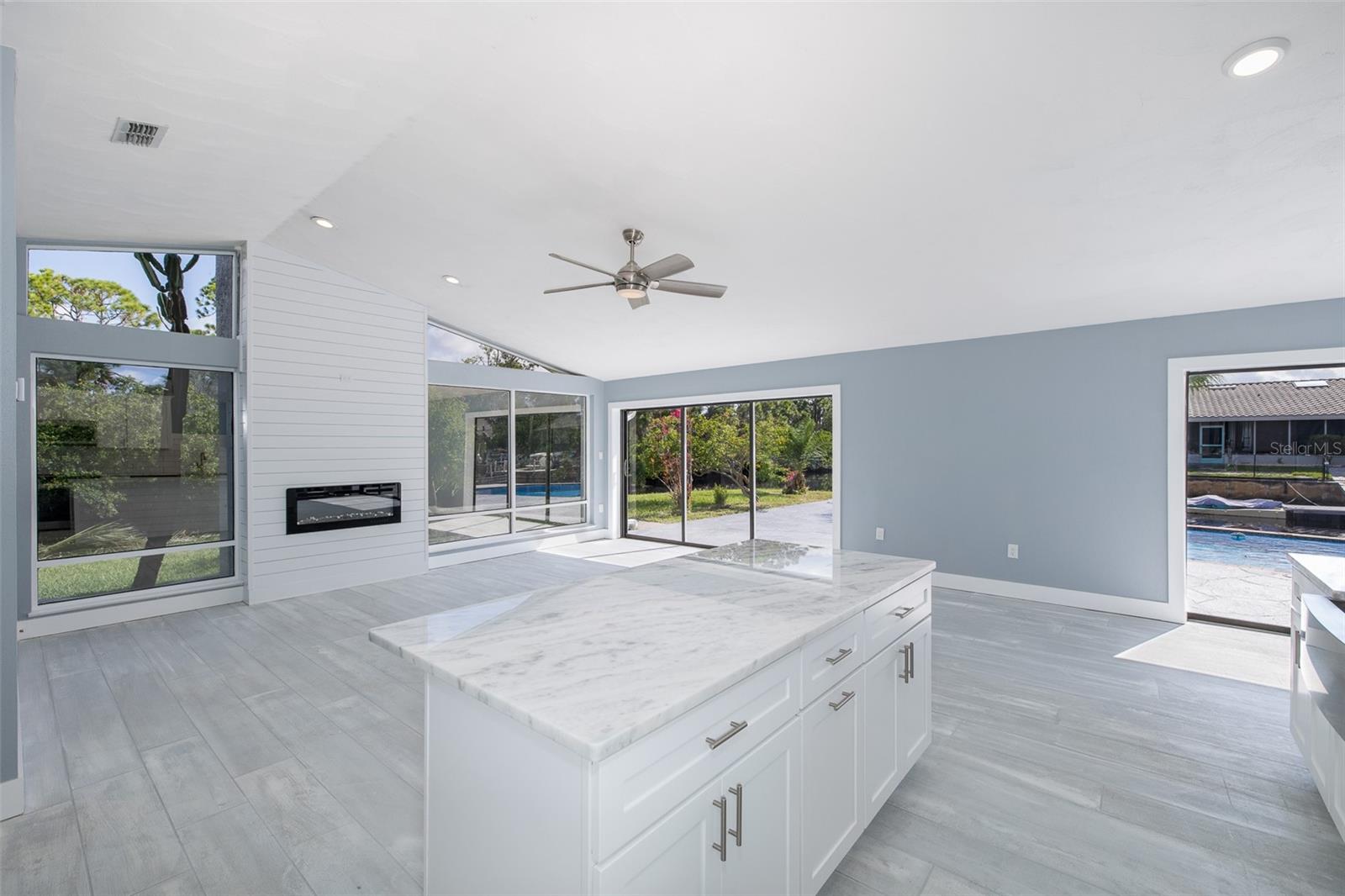 Spacious kitchen with center island overlooking the living space