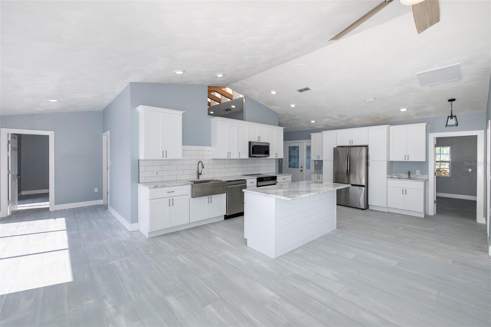 Spacious kitchen with center island overlooking the living space