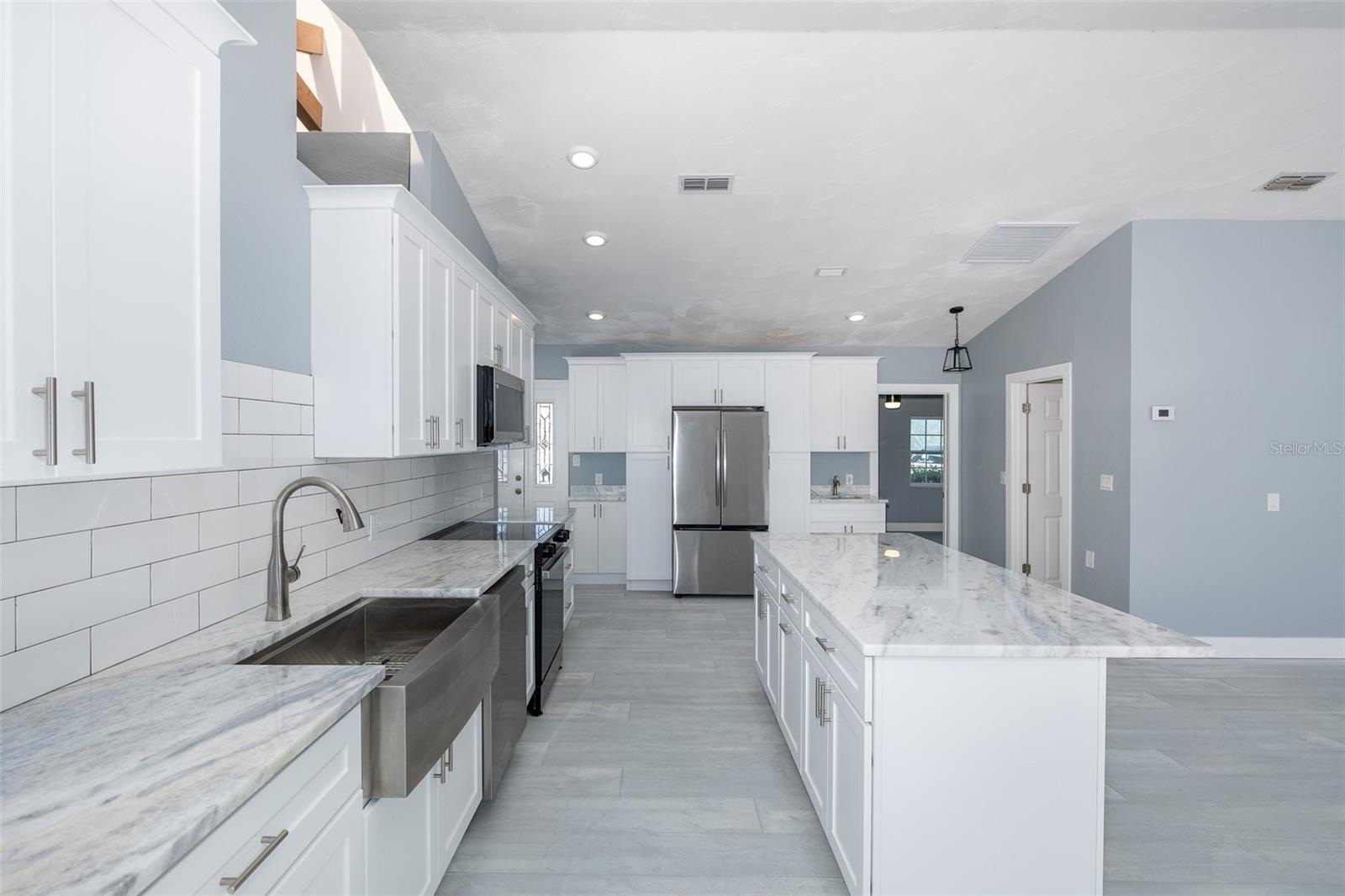 Spacious kitchen with center island overlooking the living space