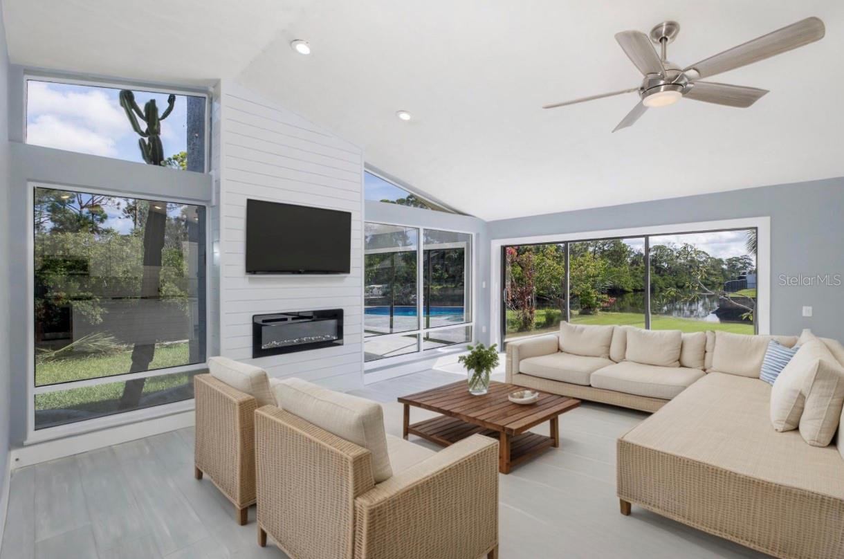 Wonderful Bright Great Room with Shiplap TV wall and fireplace