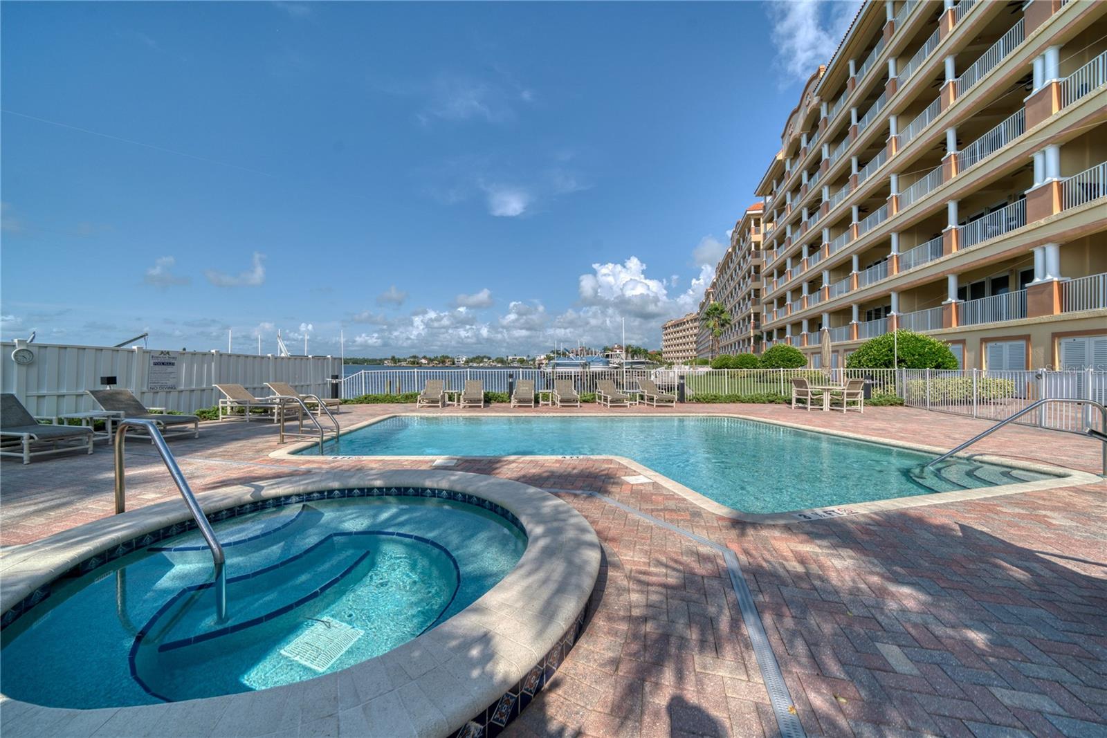 Las Brisas condo offers a gorgeous spa, poll, grill station adjacent to the boat docks and water.