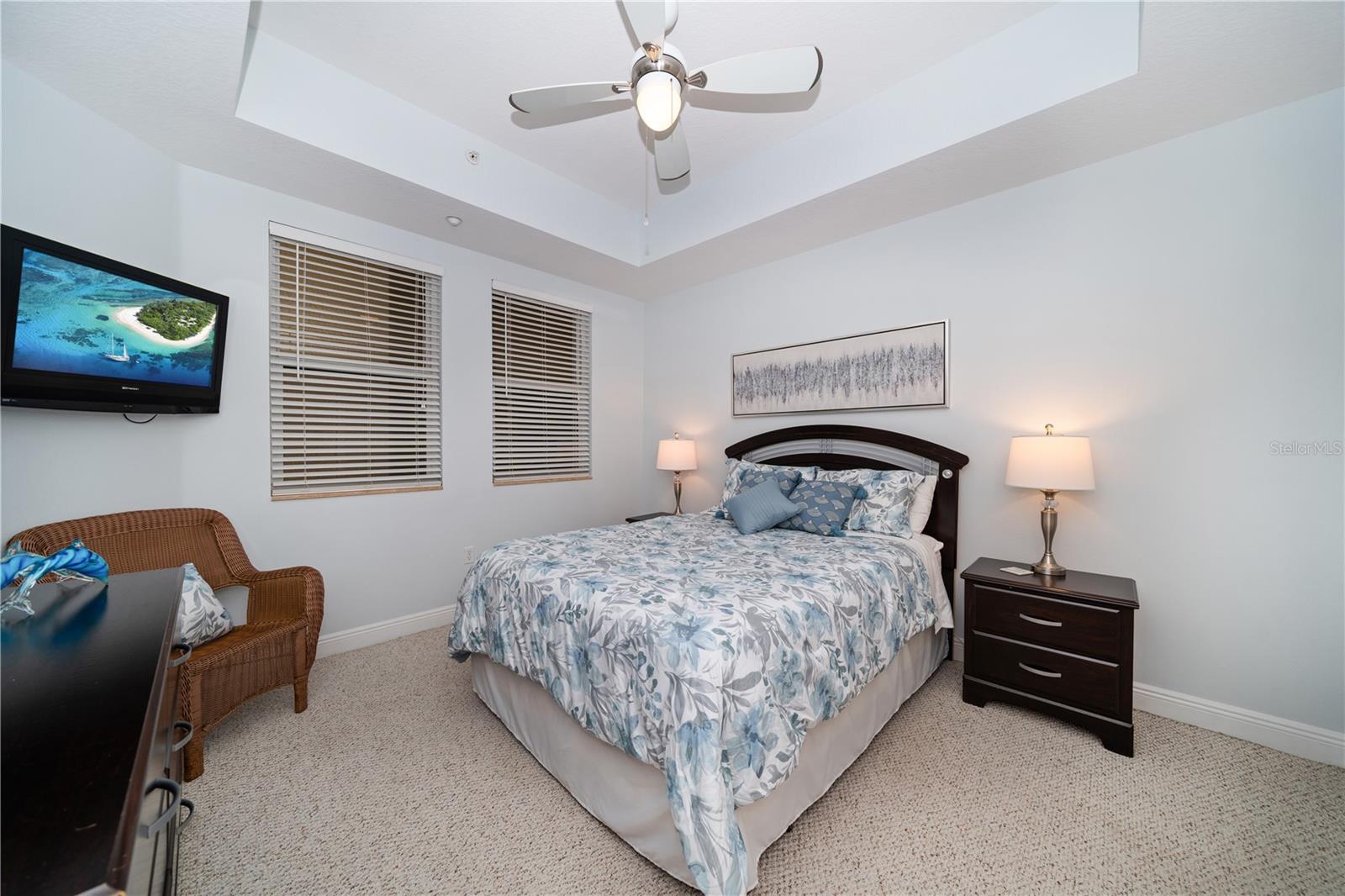 Bedroom En-suite #1 off front exterior of condo offers walk in closet & full bath