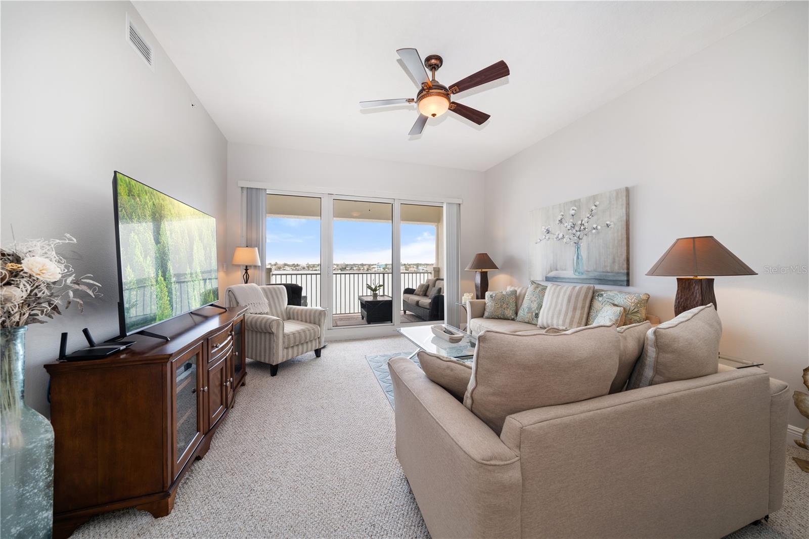 Living Room has floor to ceiling 12x8 sliding glass doors to balcony