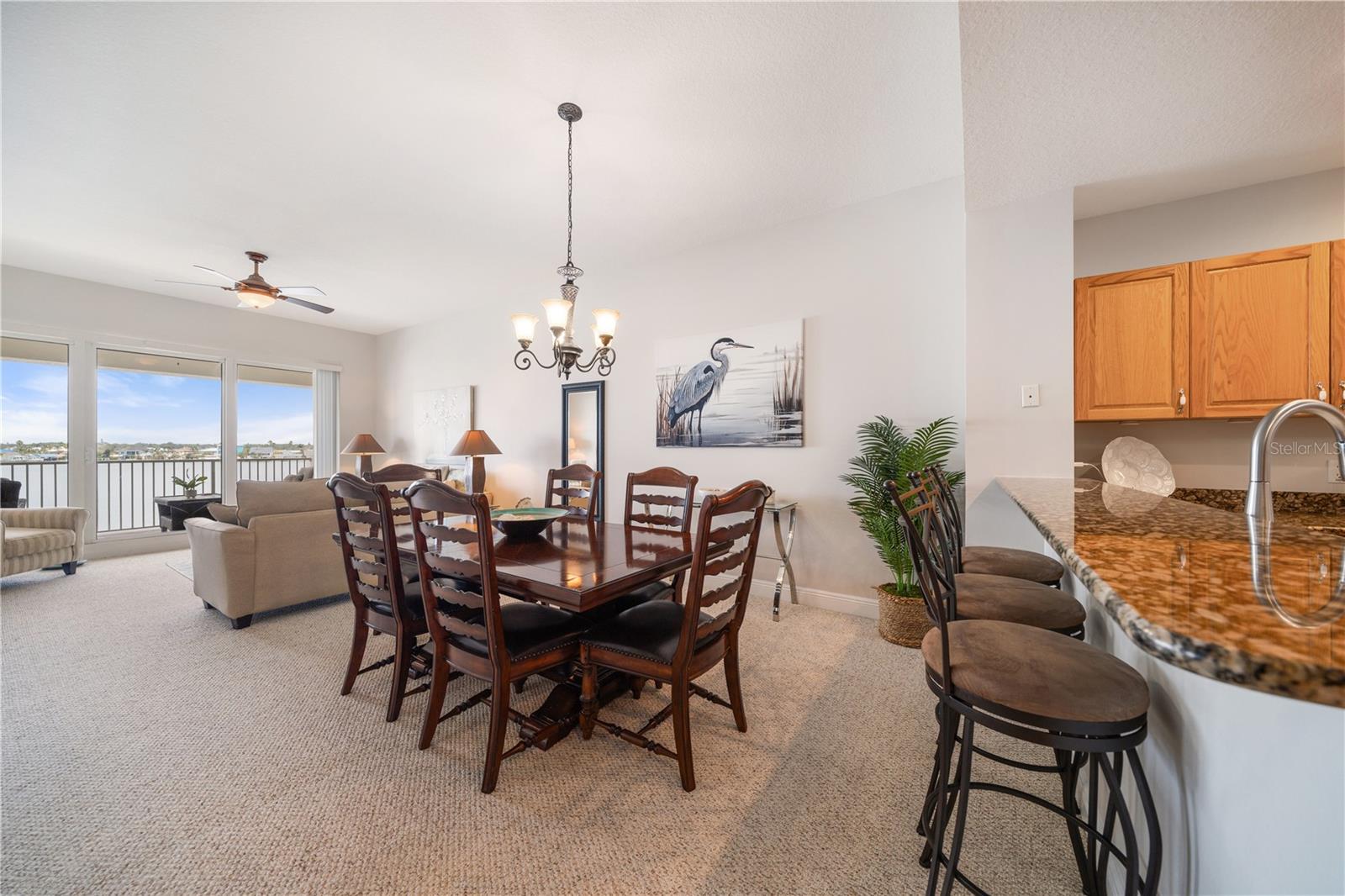 Dining room off living room boasts great views while entertaining guests for dinner