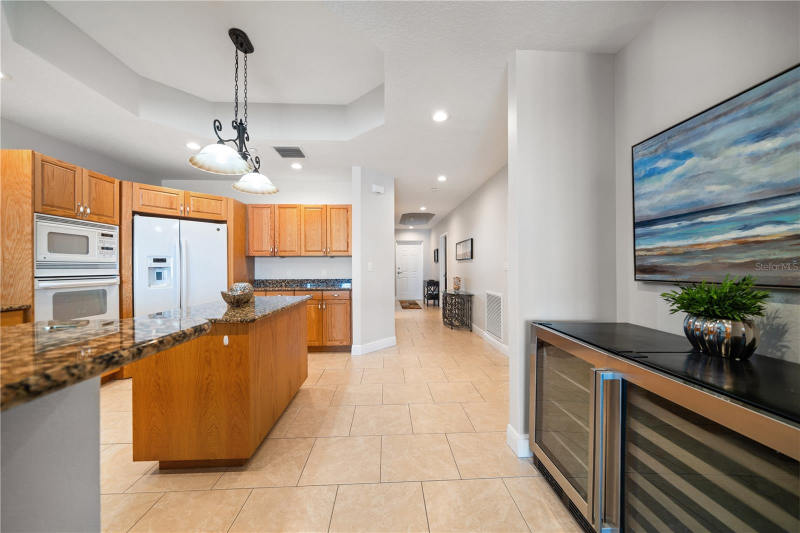 Kitchen , dry bar, laundry to the left and straight down hallway to front door