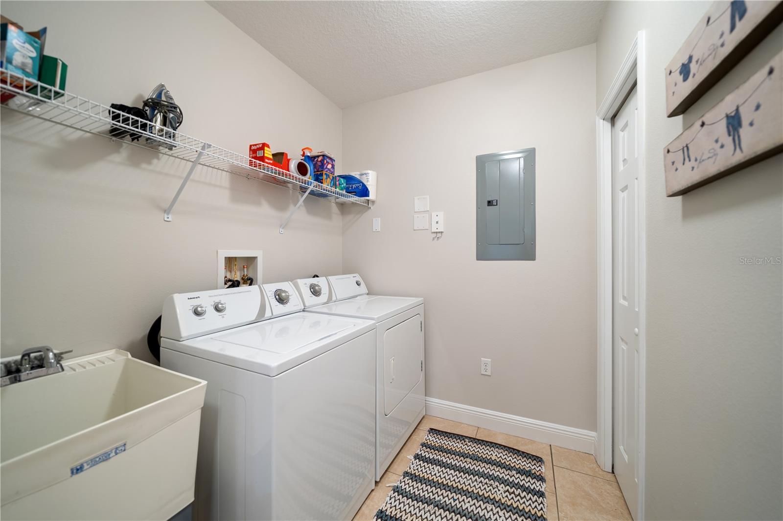 Laundry room Has a sink for go fence , and large closet for storage or used as pantry as off the kitchen