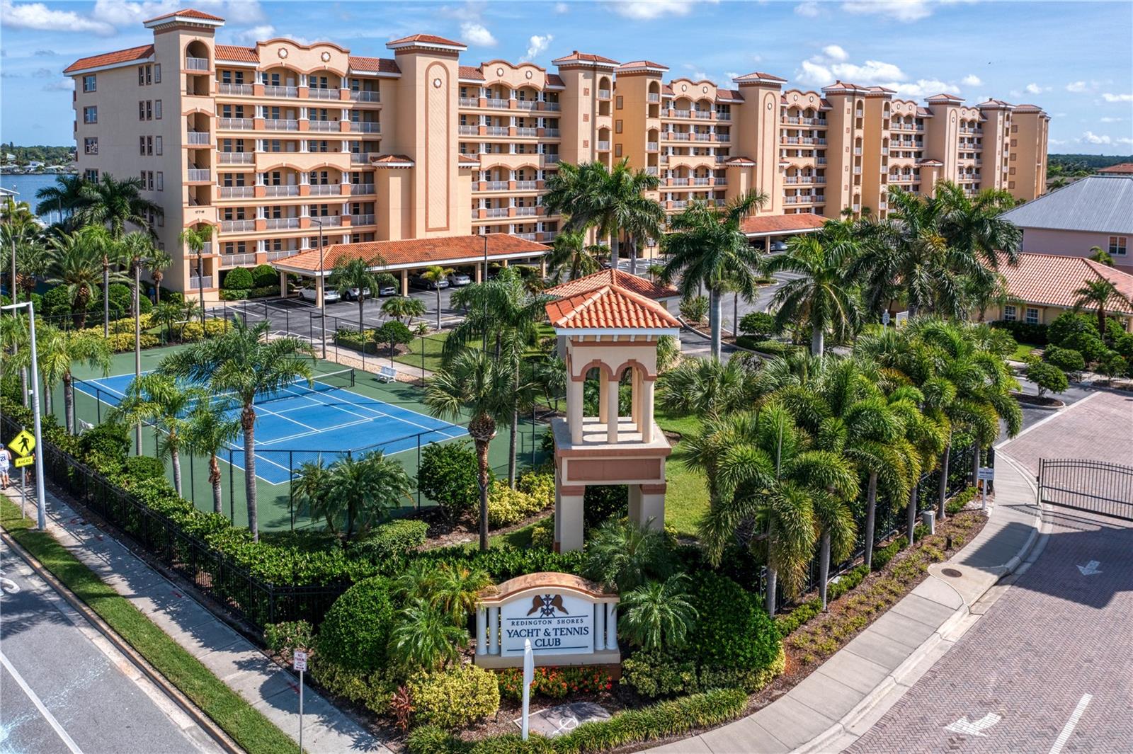 Front entry is gated amenities, encompass to tennis courts with secured gates to beach access in abundance of parking clubhouse, private pools, and residential walkways