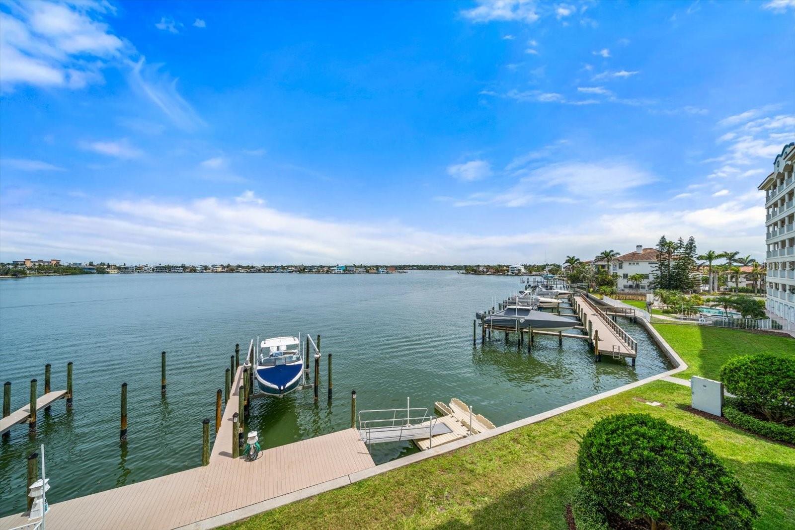 Community Boat Docks in the exterior of this condo sitting on Boca Ciega Bay Intercoastal waterway .