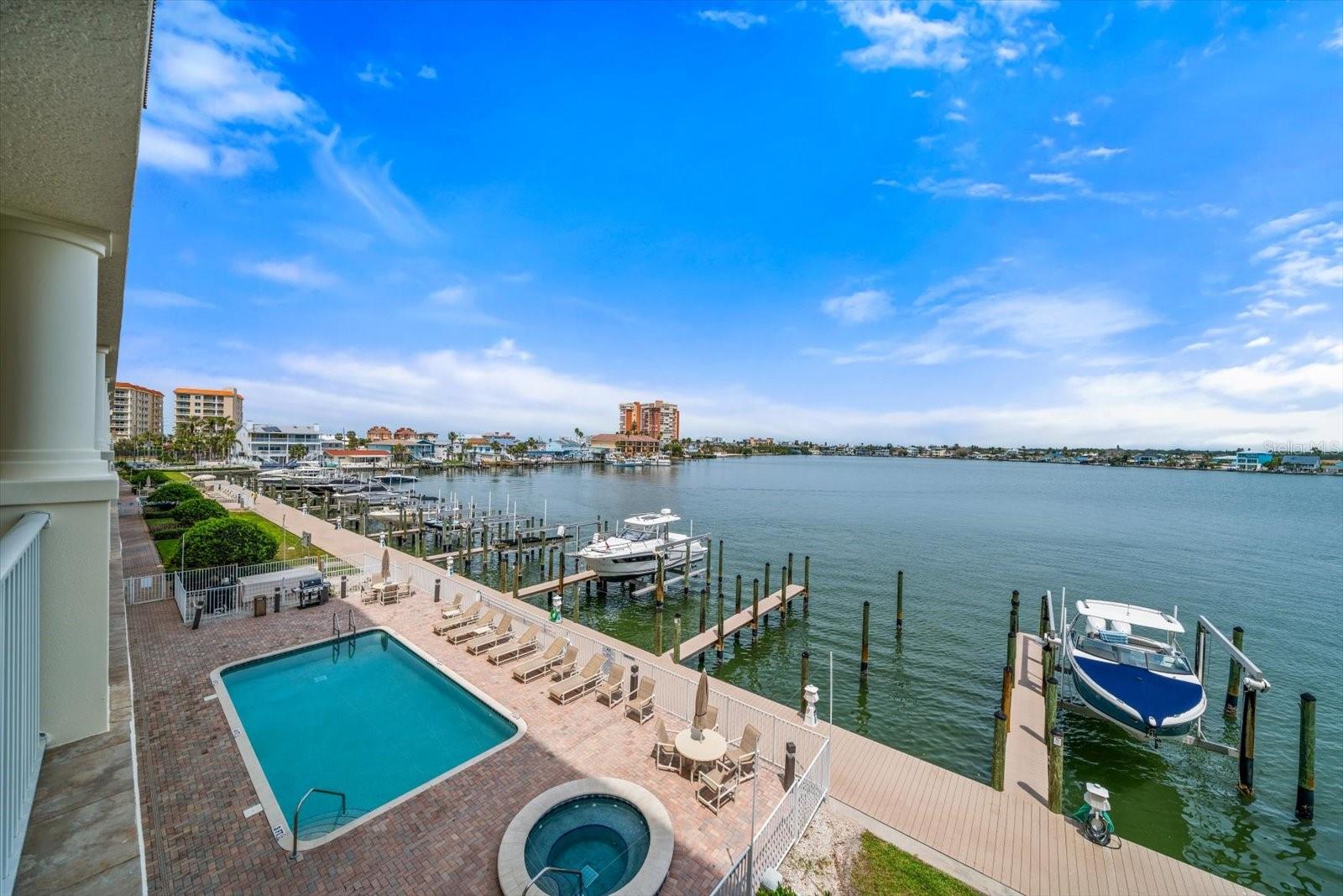 Exterior pool , spa , docks, and kayak station are to the immediate exterior of your 3rd floor condo . Facing north west views , great for catching the sunset .