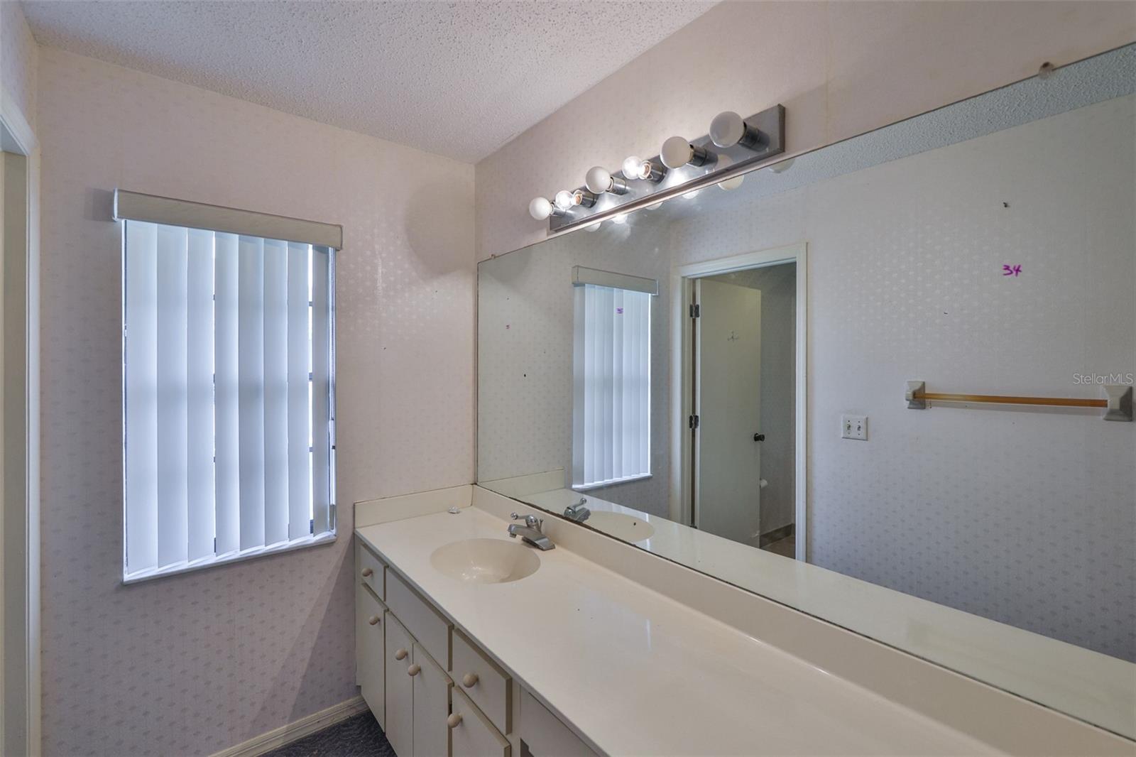 Bathroom 1 - Good size bathroom with windows for natural light.