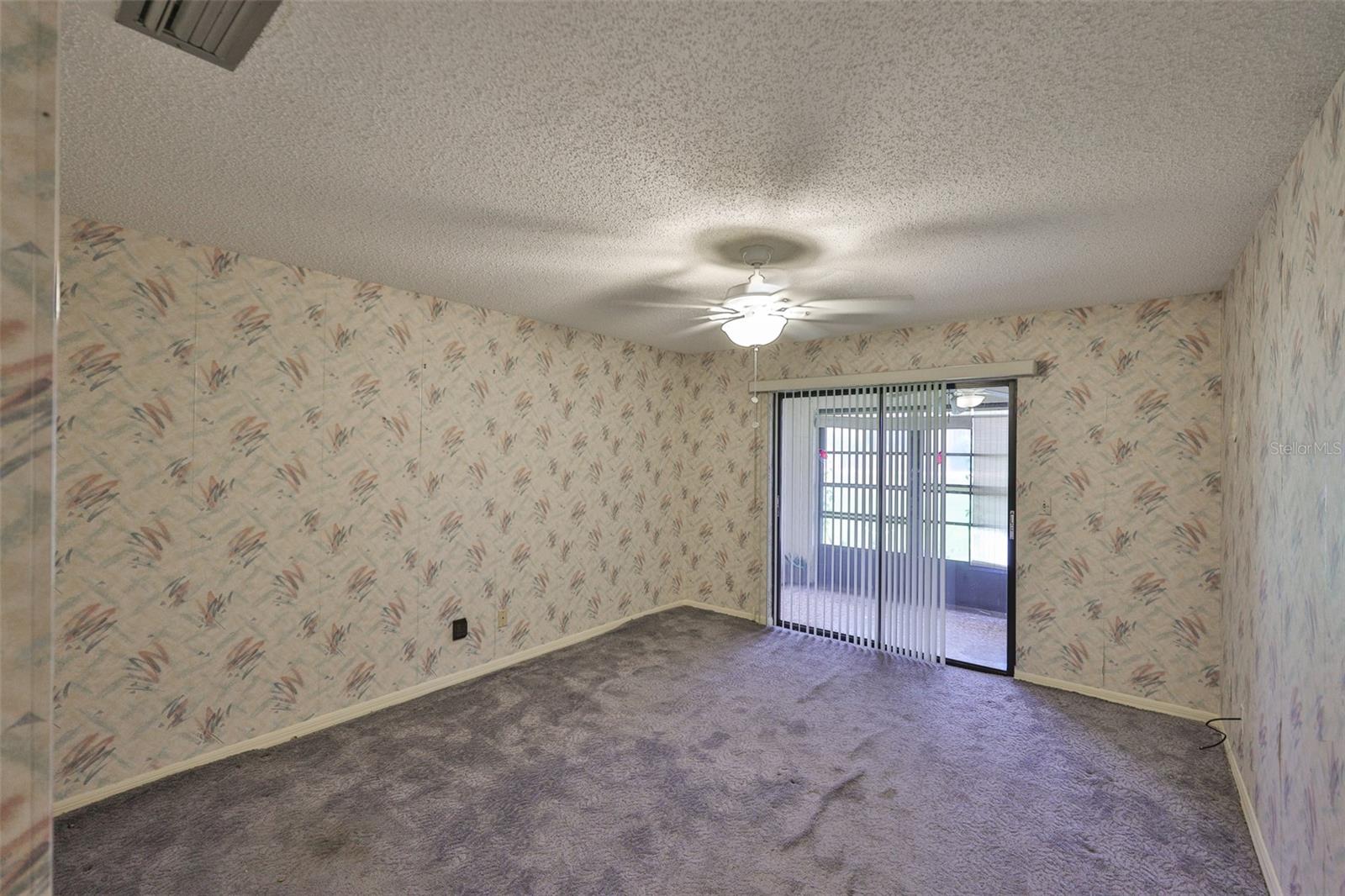 Bedroom 2 - Sliding glass doors onto the Florida room, really open up this space.