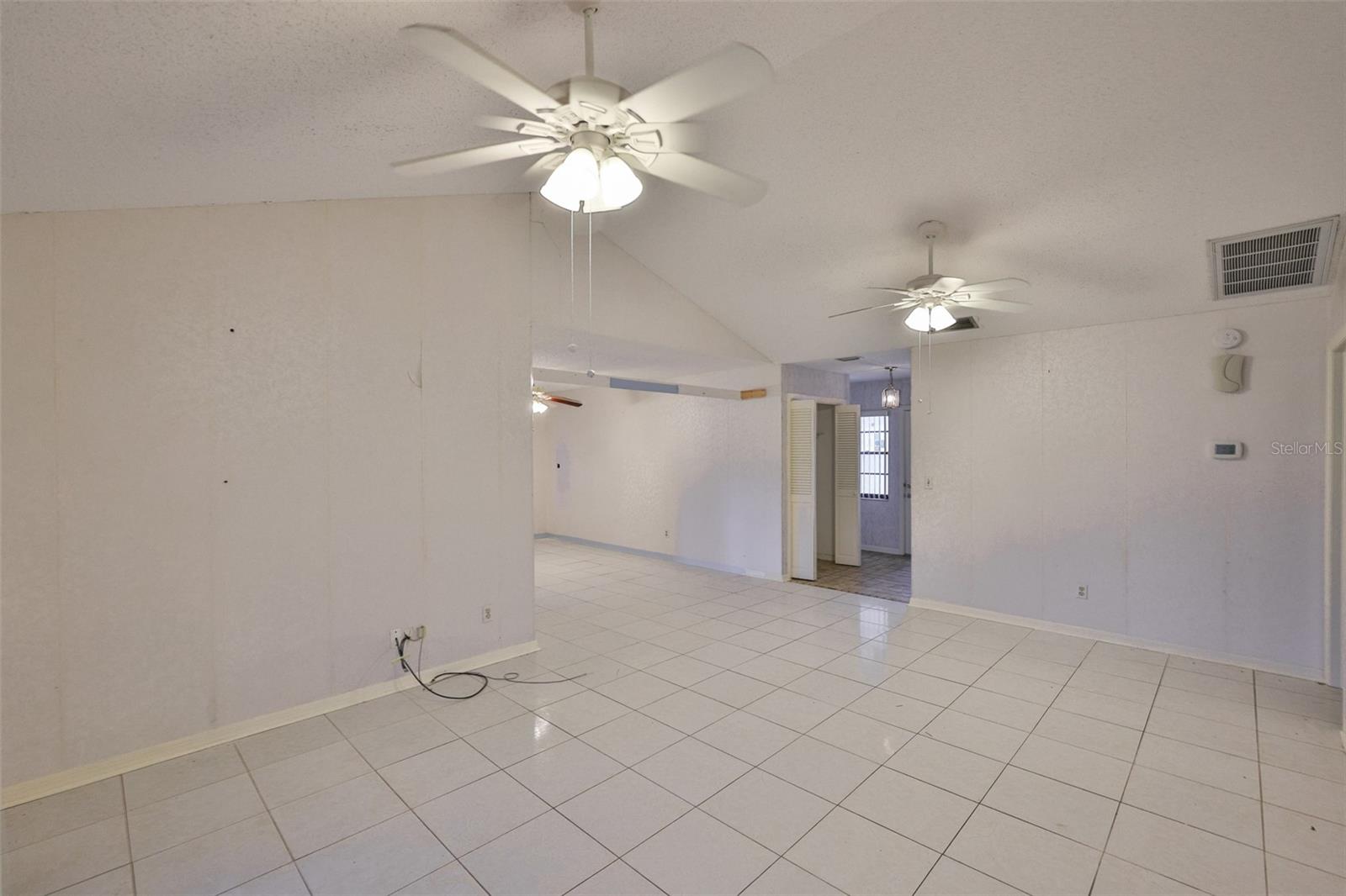 Great room is fully tiled and the dining room is off to the right, as you walk in.