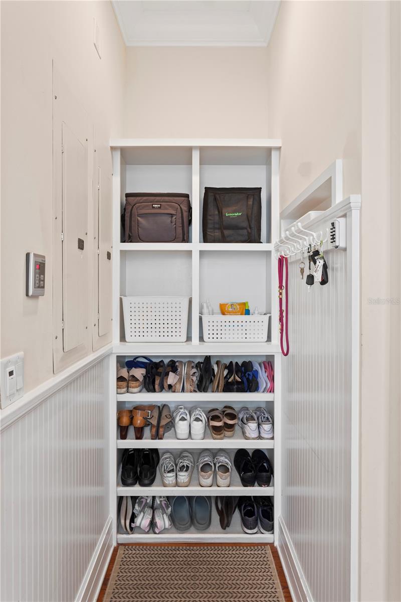 The thoughtfully designed mudroom-an ideal drop zone for shoes and bags, keeps everyday essentials organized as you enter the home.