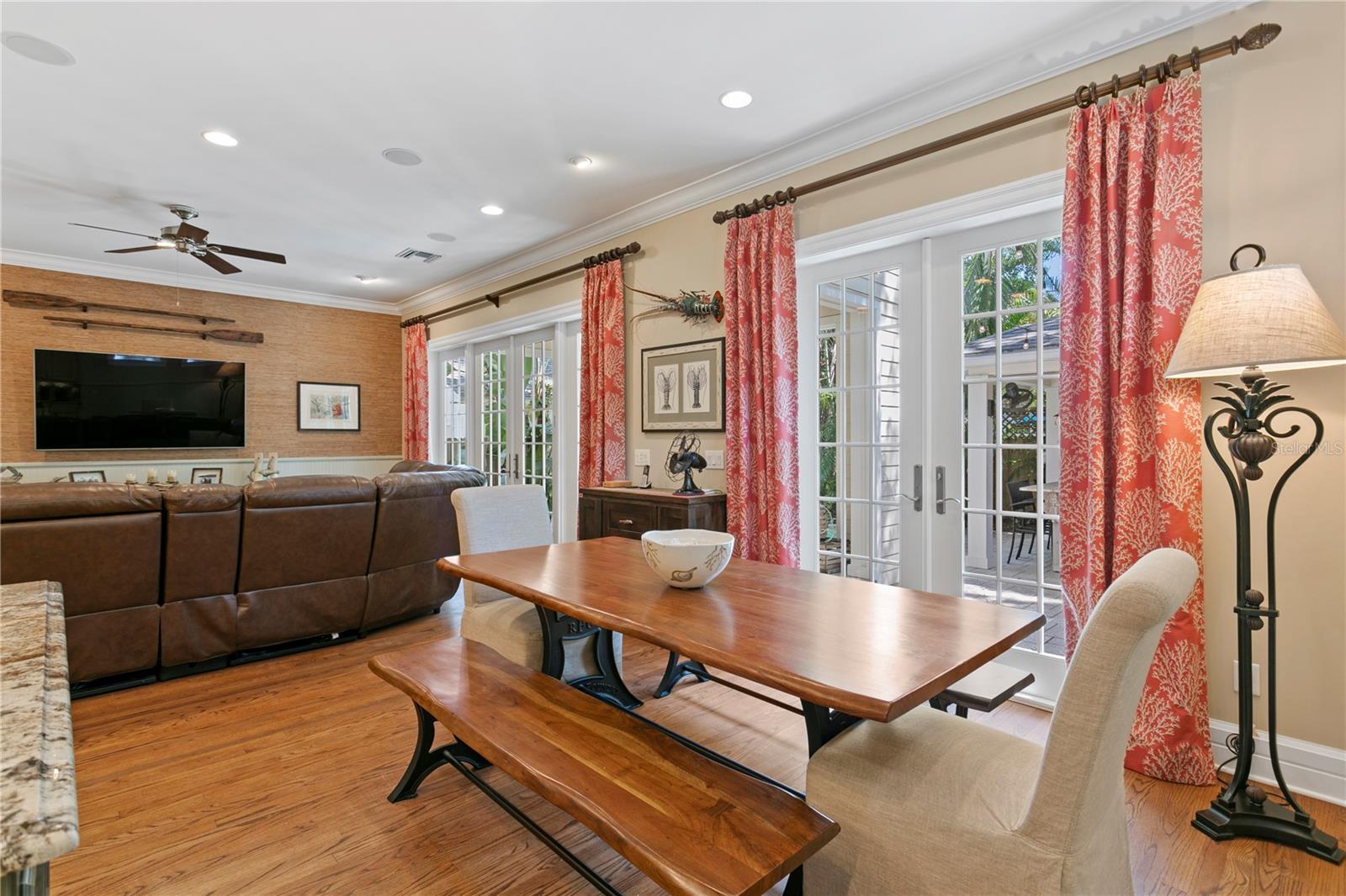 Here's a perfect spot for a large kitchen table, perfectly positioned between the kitchen and family room to create a warm, shared space where everyone can gather together and connect.
