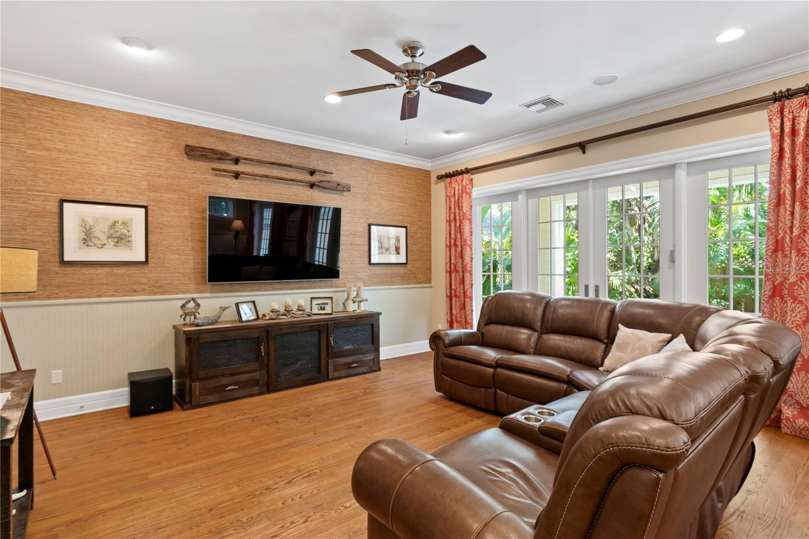 This generously sized family room, just off the kitchen and backyard, is perfect for game days and movie nights.