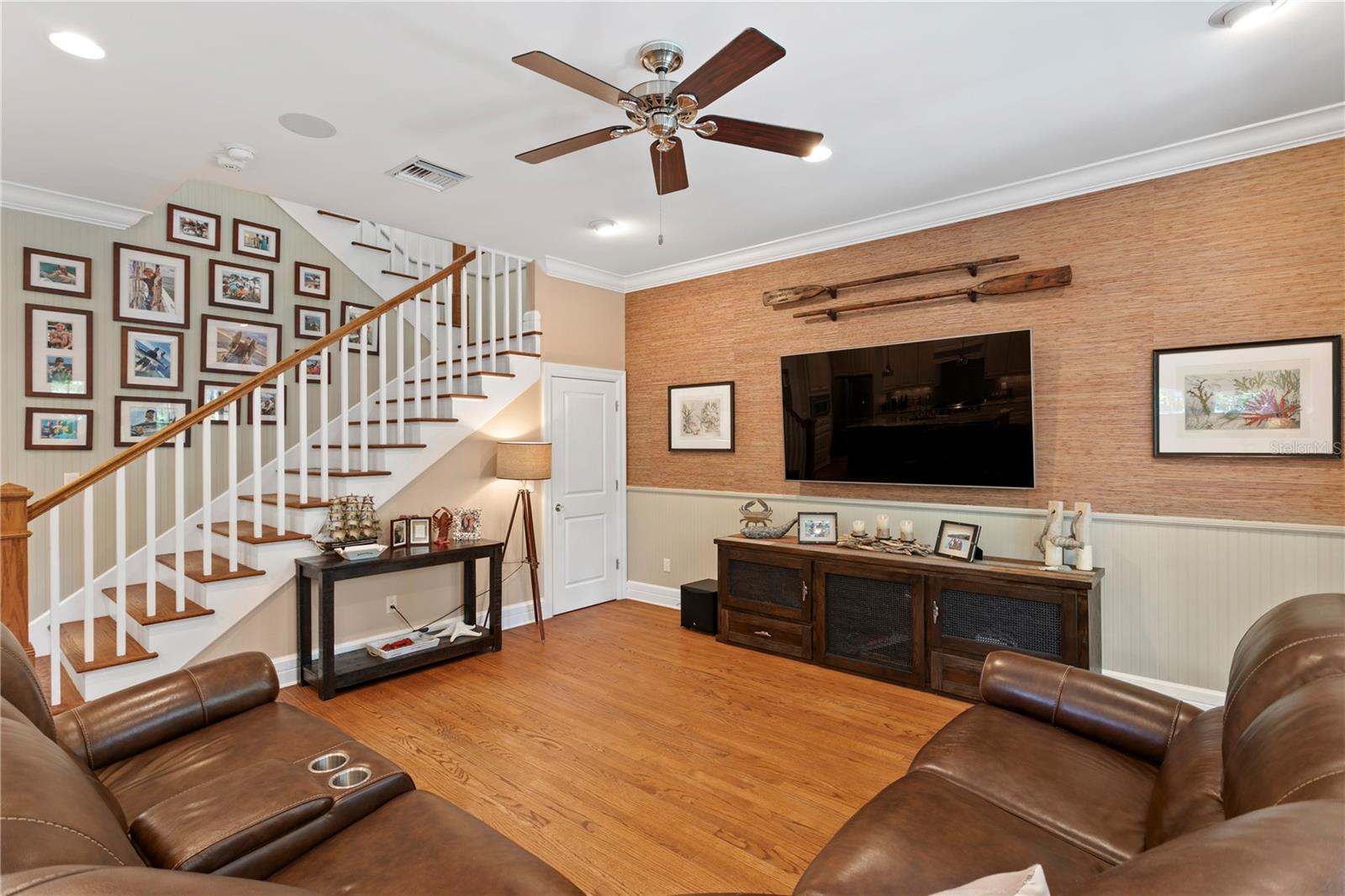 The family room features convenient under-stair storage.