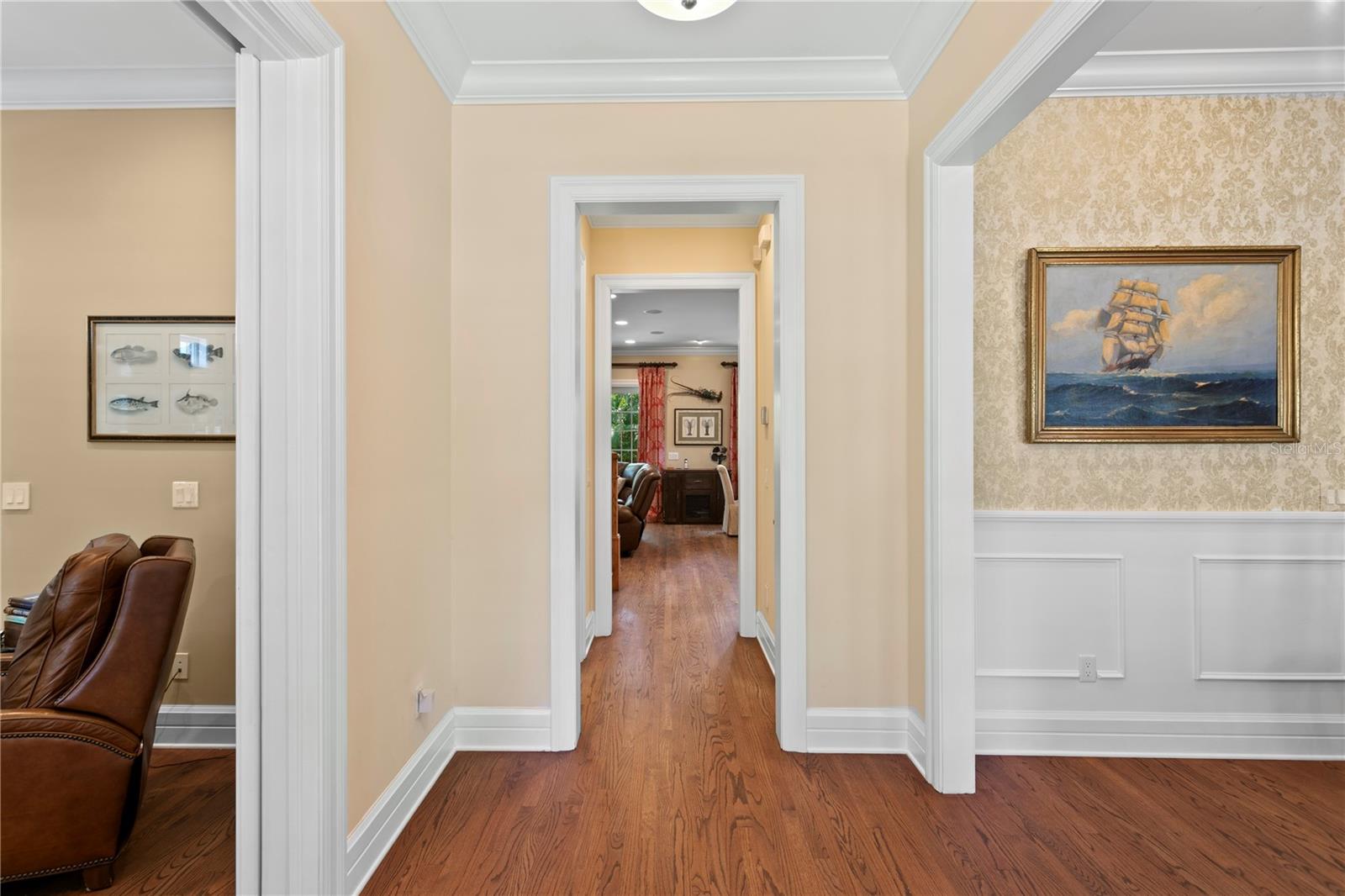 The thoughtfully designed floor plan features 10-foot ceilings on both levels, crown molding, plantation shutters, and solid oak floors throughout, creating a sense of openness and sophistication.