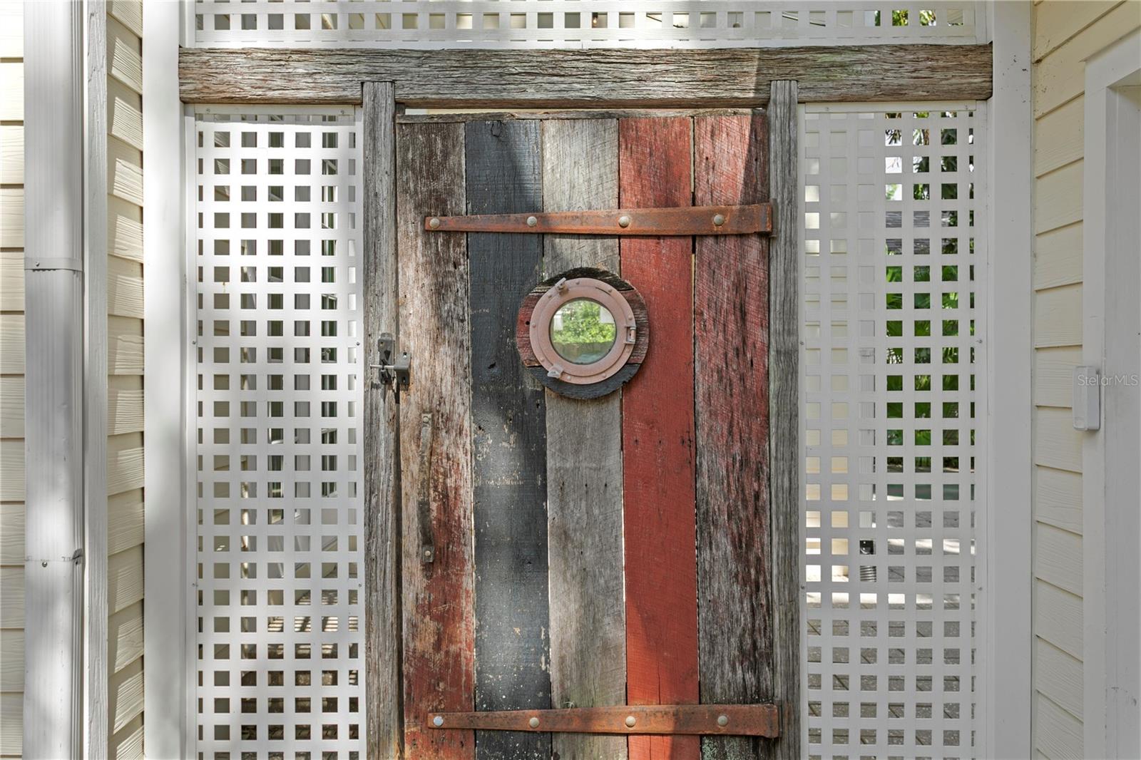This amazing home features details like this custom door made of reclaimed wood.