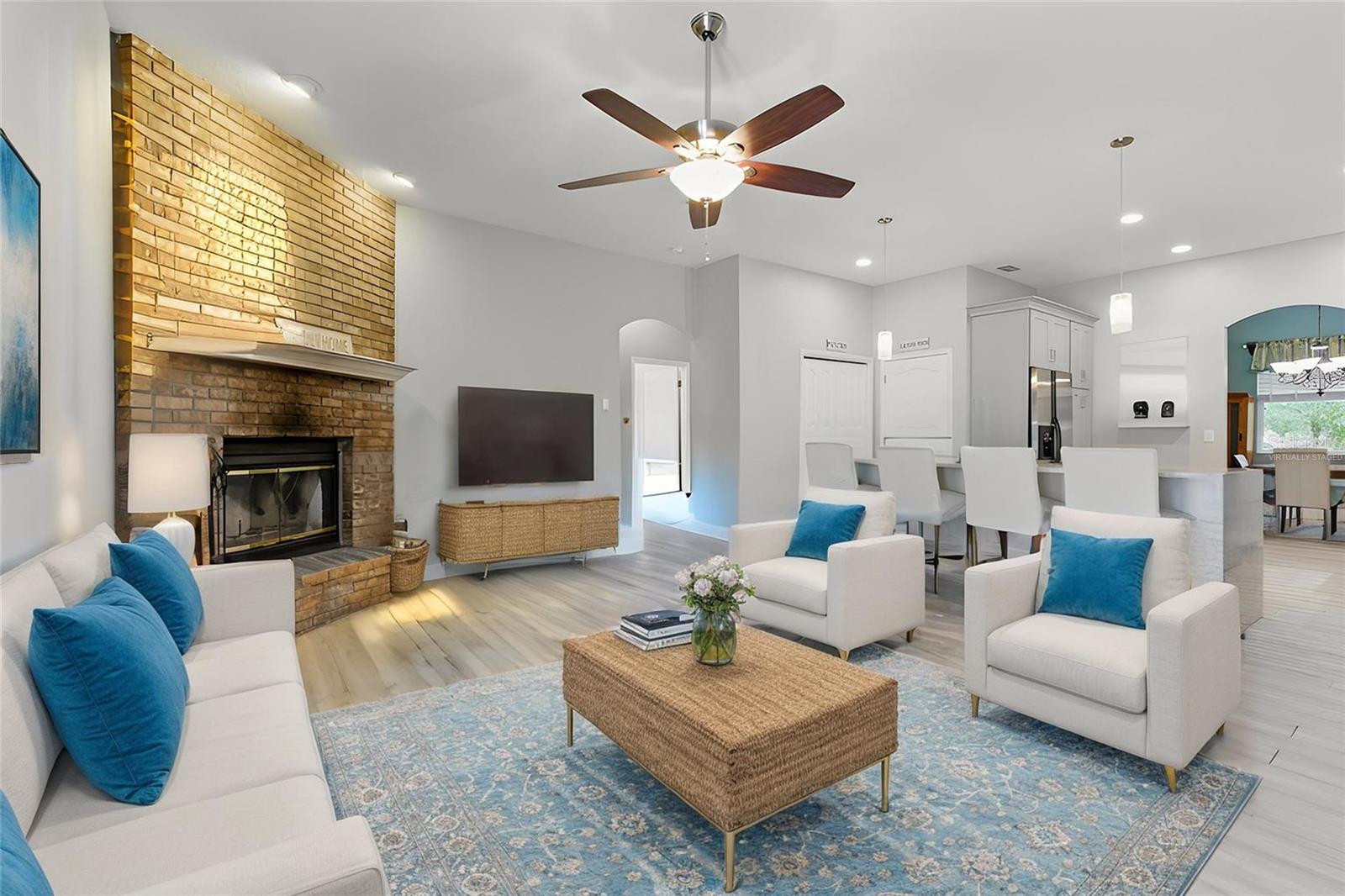 Open living area to the kitchen and pool!  This photo virtually staged!