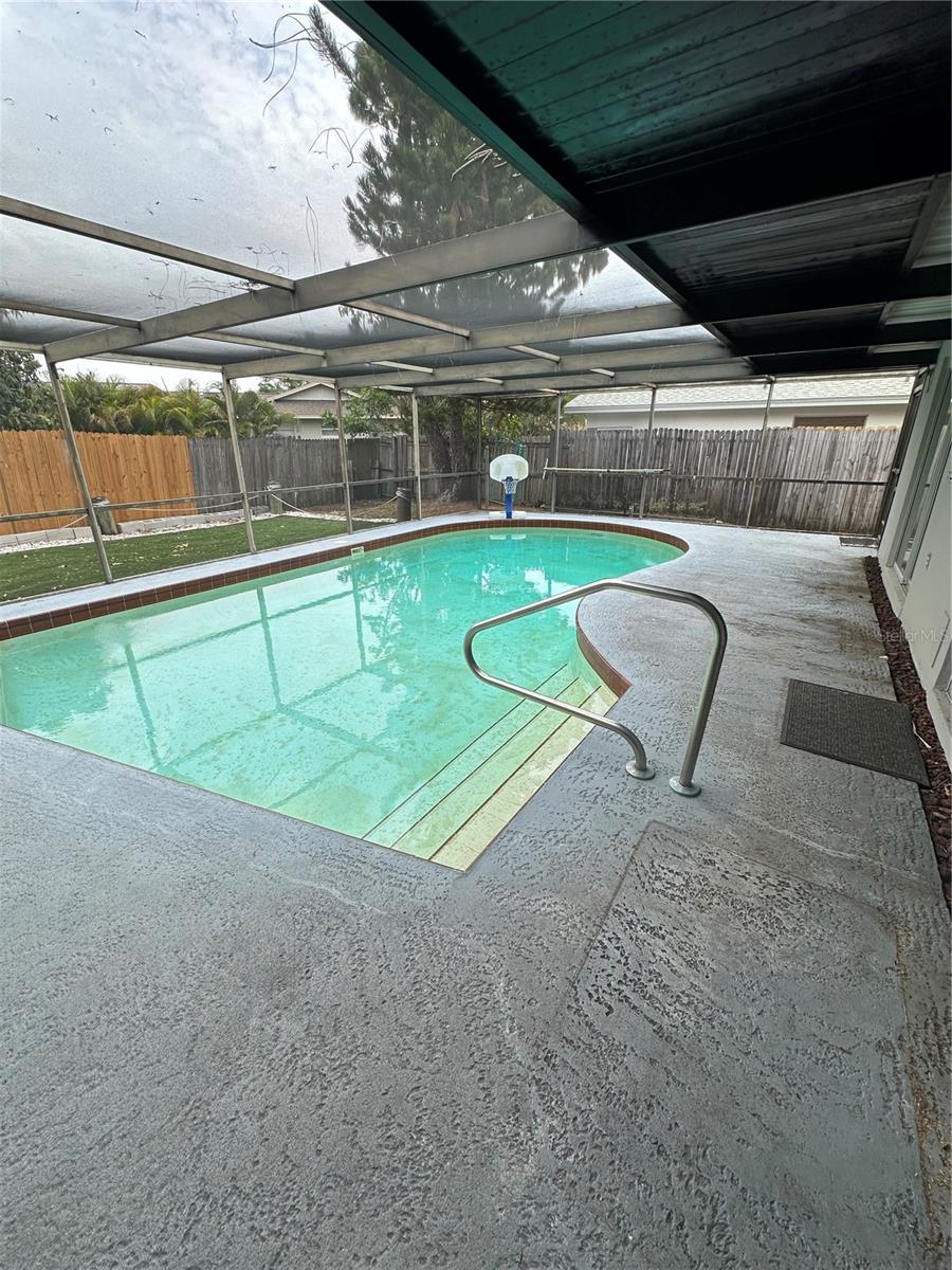 Sparkling pool and large pool deck.