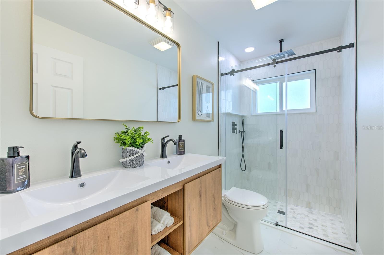 Primary Bathroom with glass walk-in shower and double sinks