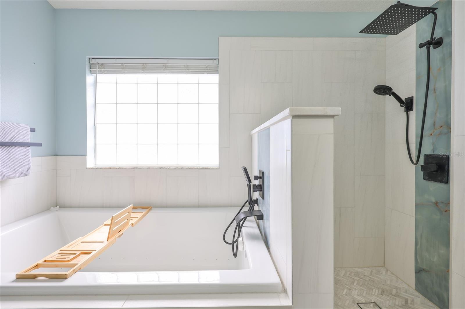The remodel was done in 2024 to include this Air tub or Bubble Jet Tub and gorgeous Rainshower with handheld sprayer