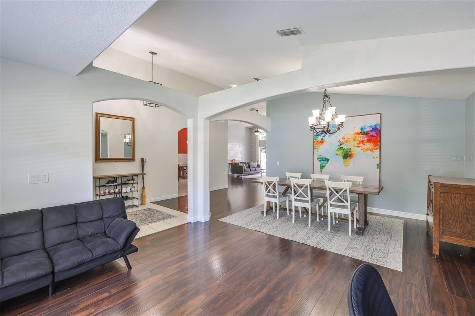 Arch overhead separates rooms without losing open feeling