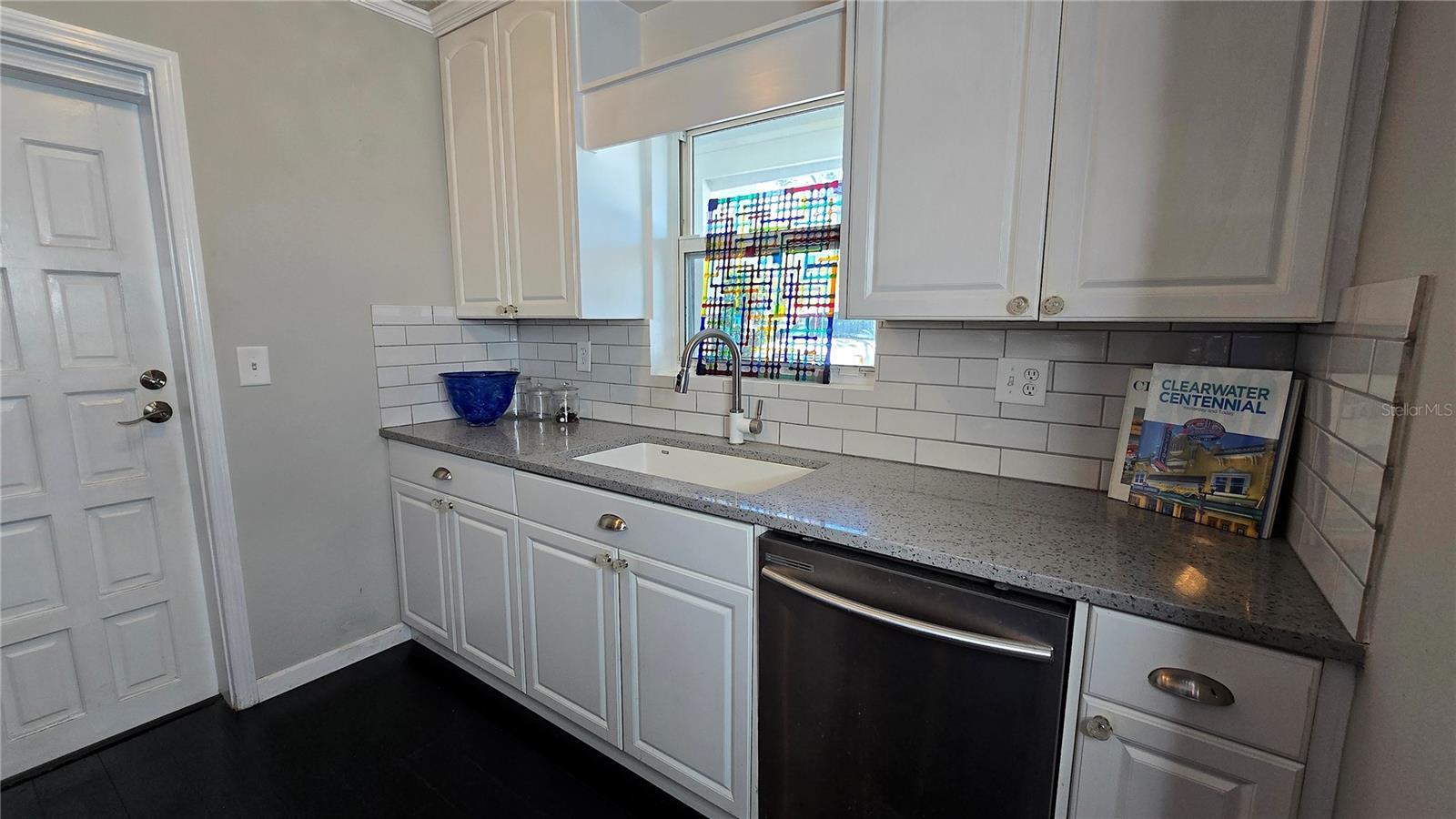 Plenty of Kitchen cabinets.  Door gives access to the 1 car attached garage.