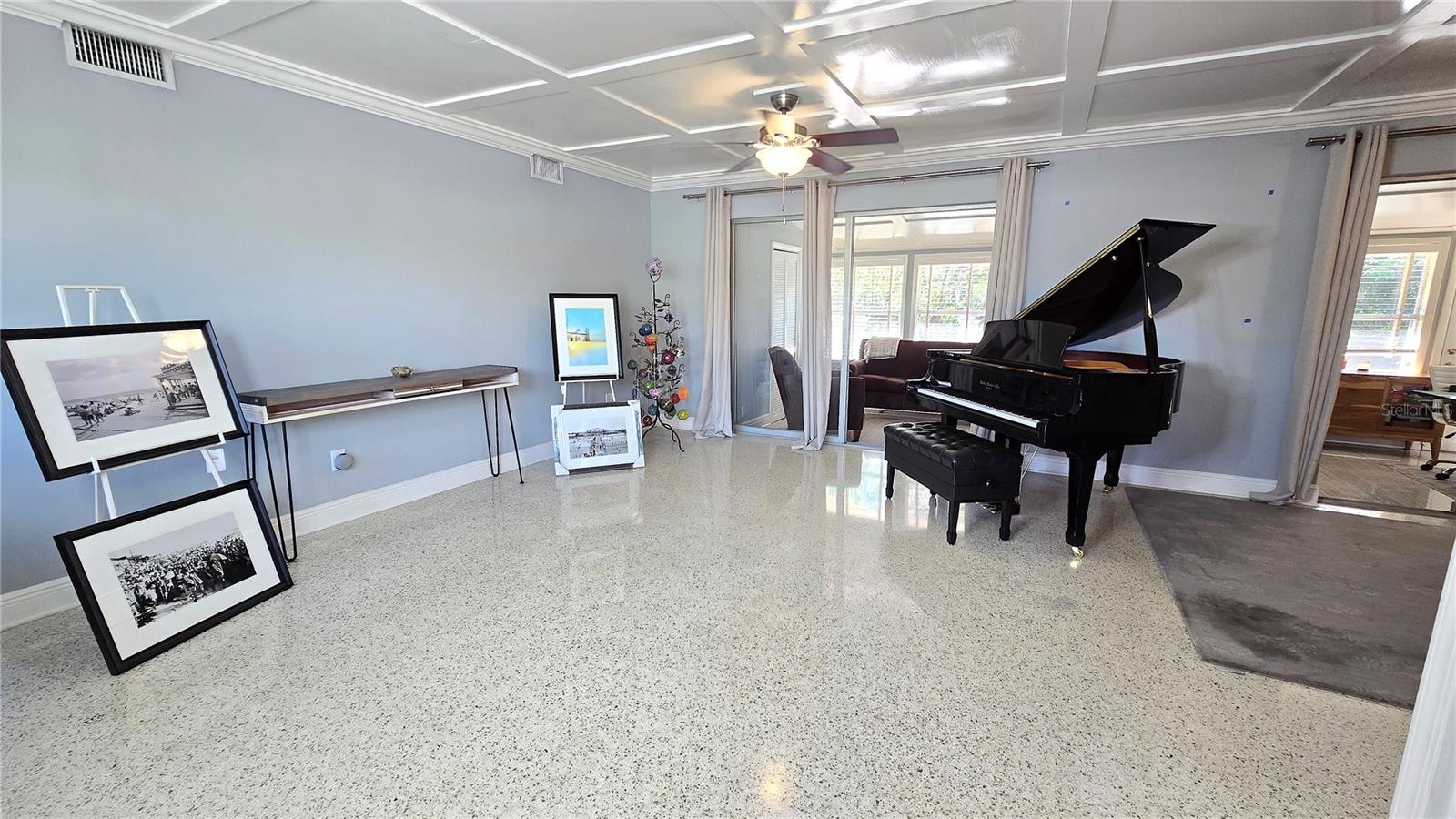 Nice size living room with terrazzo flooring