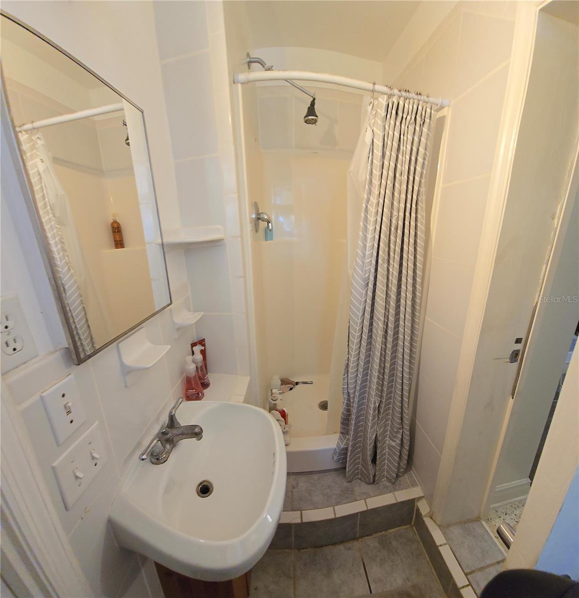 Second bathroom off of the dining room and attached garage.