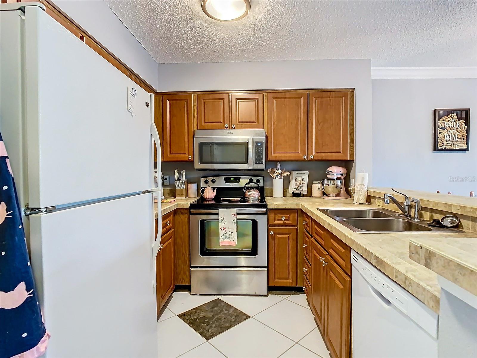 Ample Kitchen storage. Stainless oven and microwave.