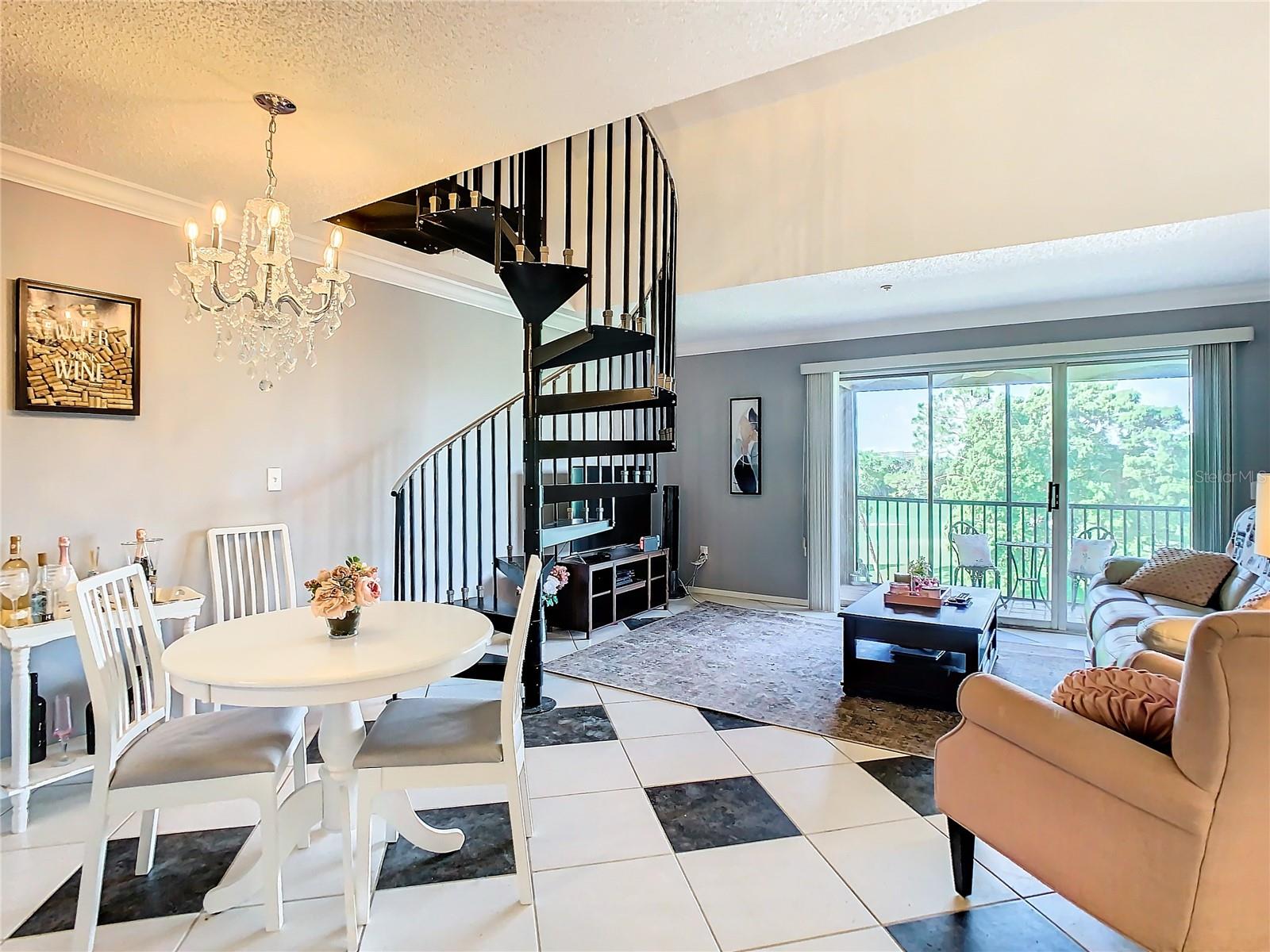 Wrought iron spiral stairs to loft living space.