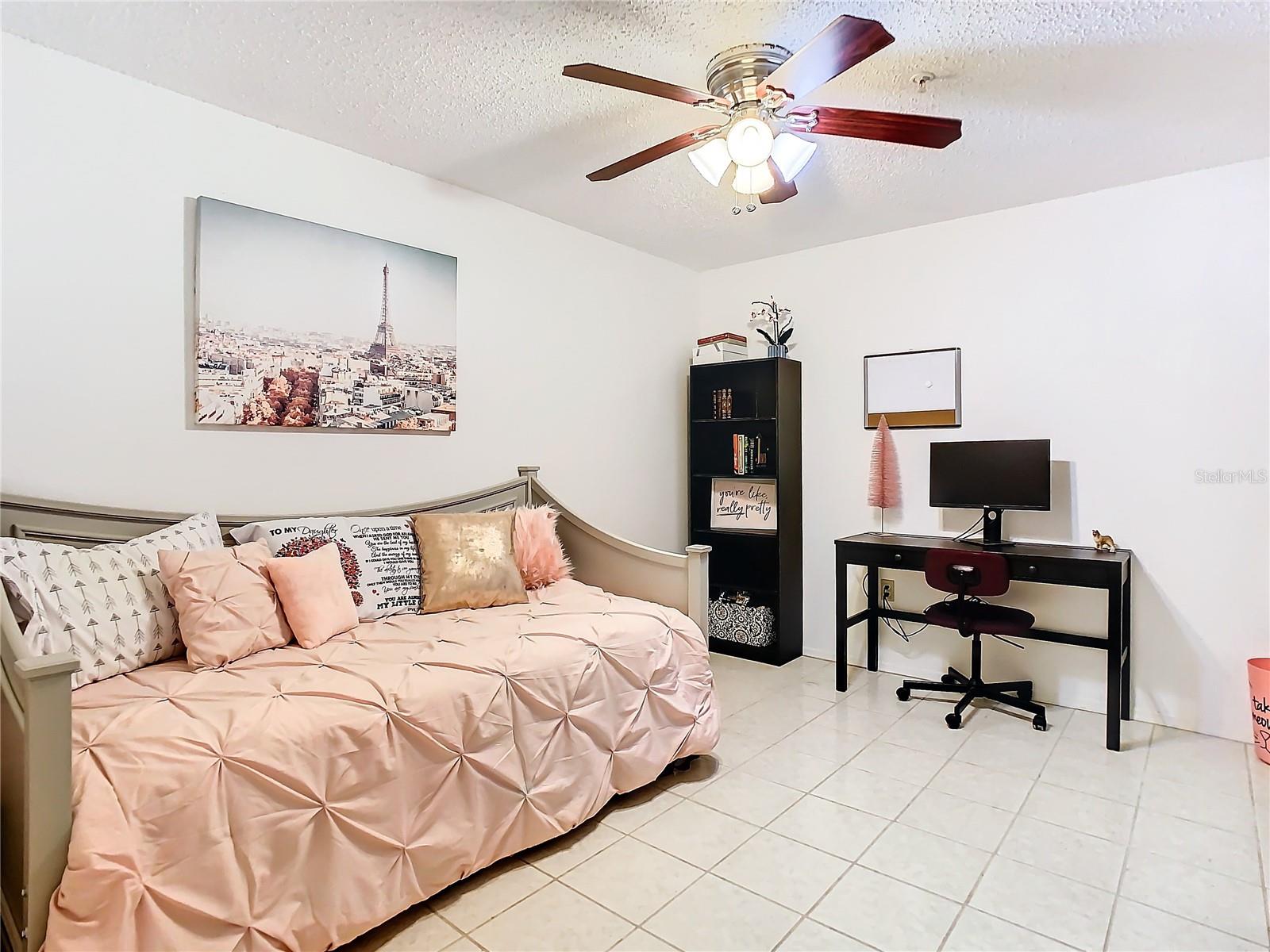 Versatile loft/den with tile flooring.