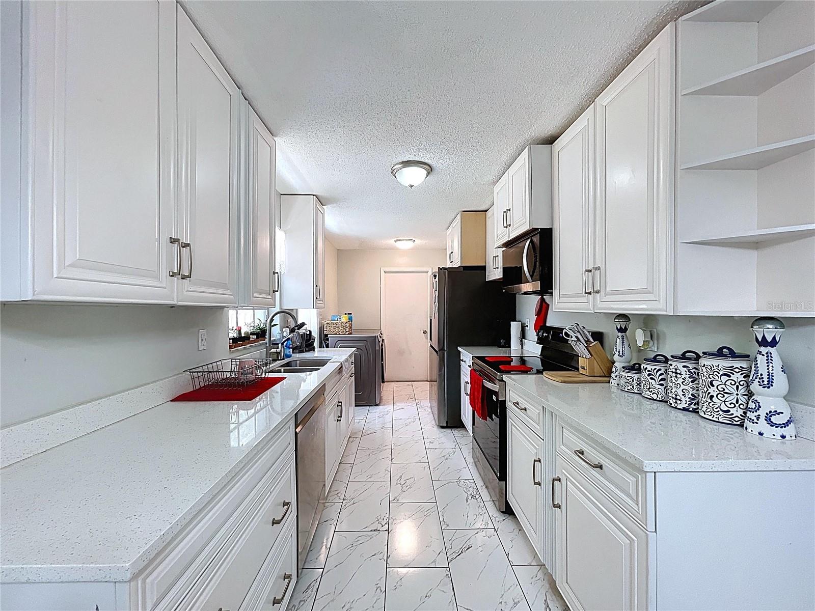 Kitchen features quartz countertops.