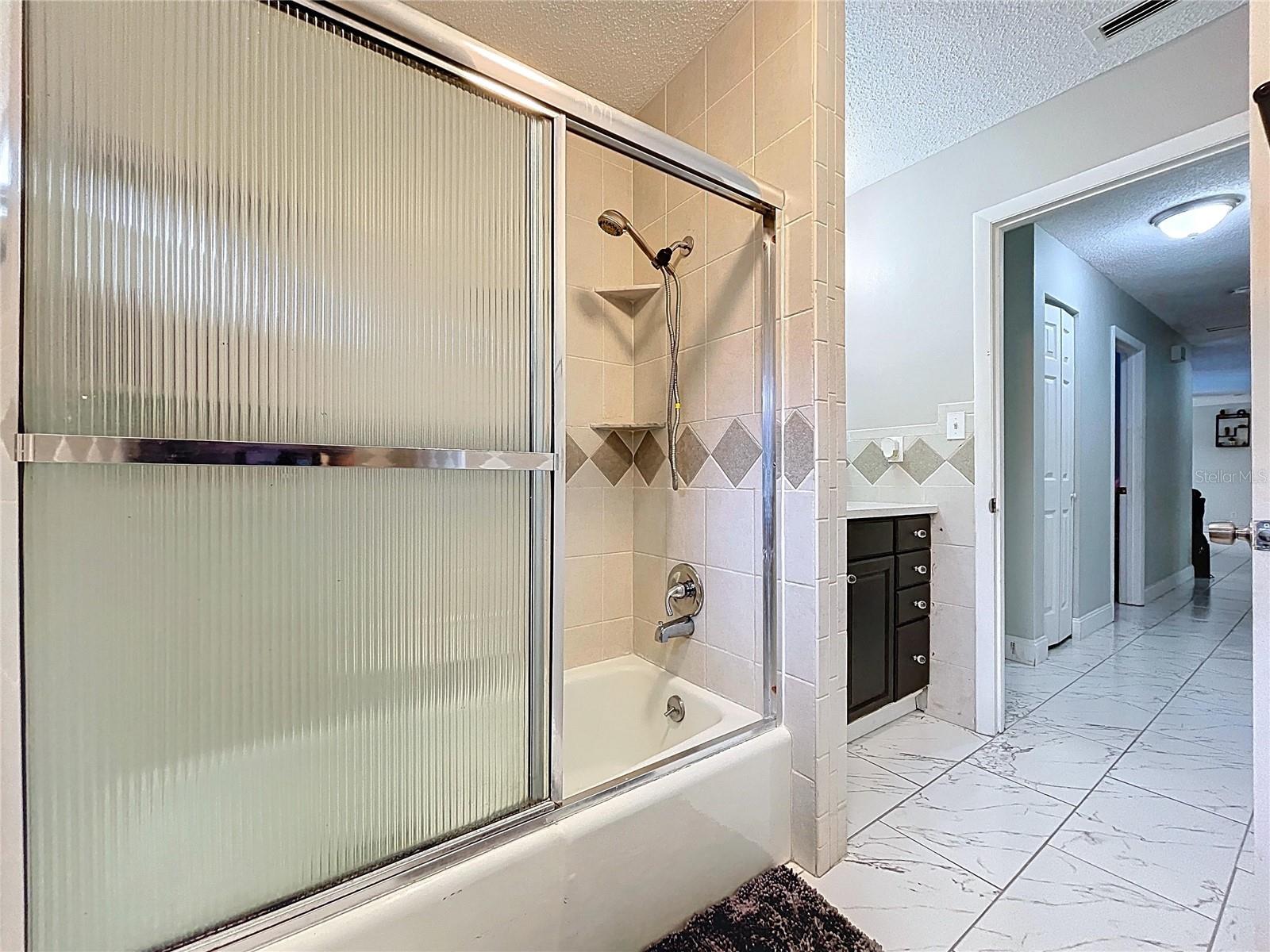 Guest bathroom with tub.