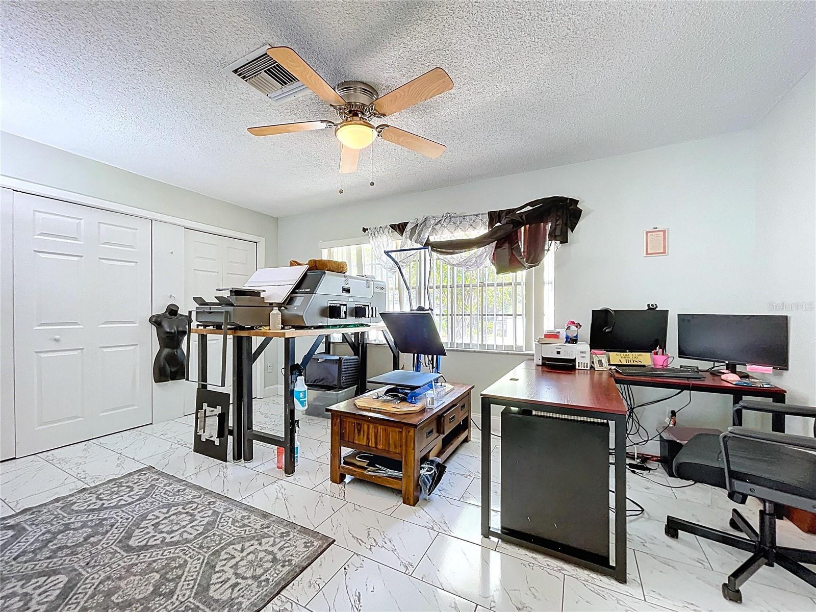 Large 4th bedroom, currently used as in-home office.