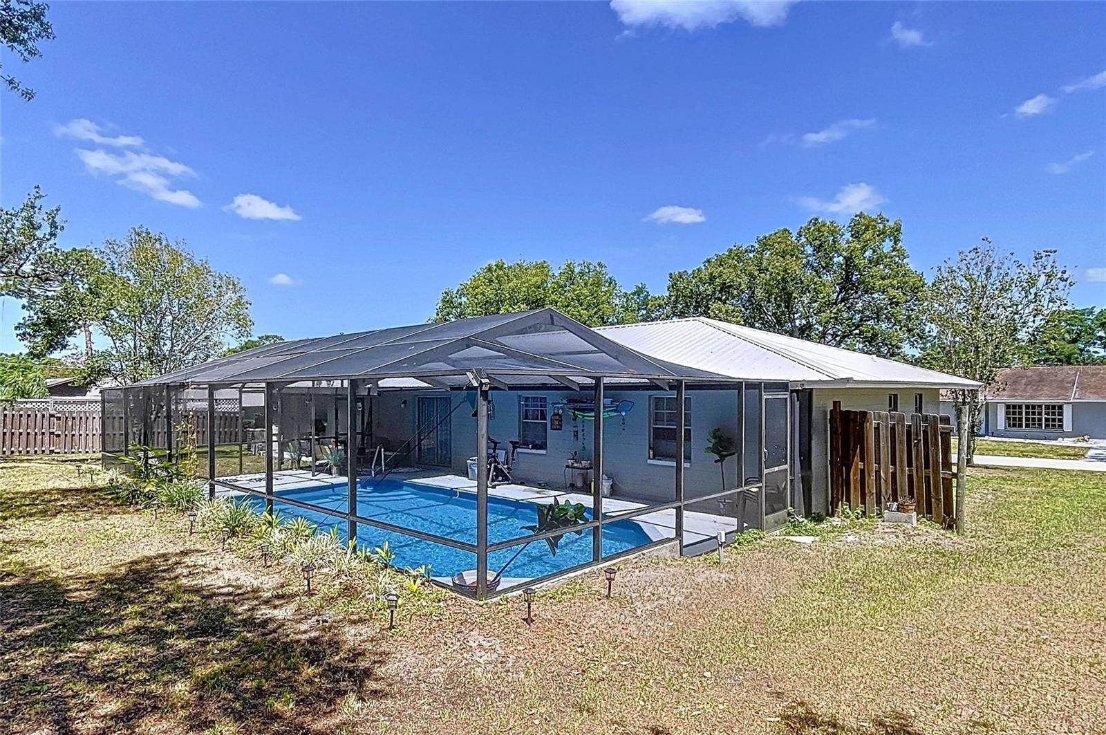 Brooksville pool home with plenty of yard space for outdoor activities or your family pets.