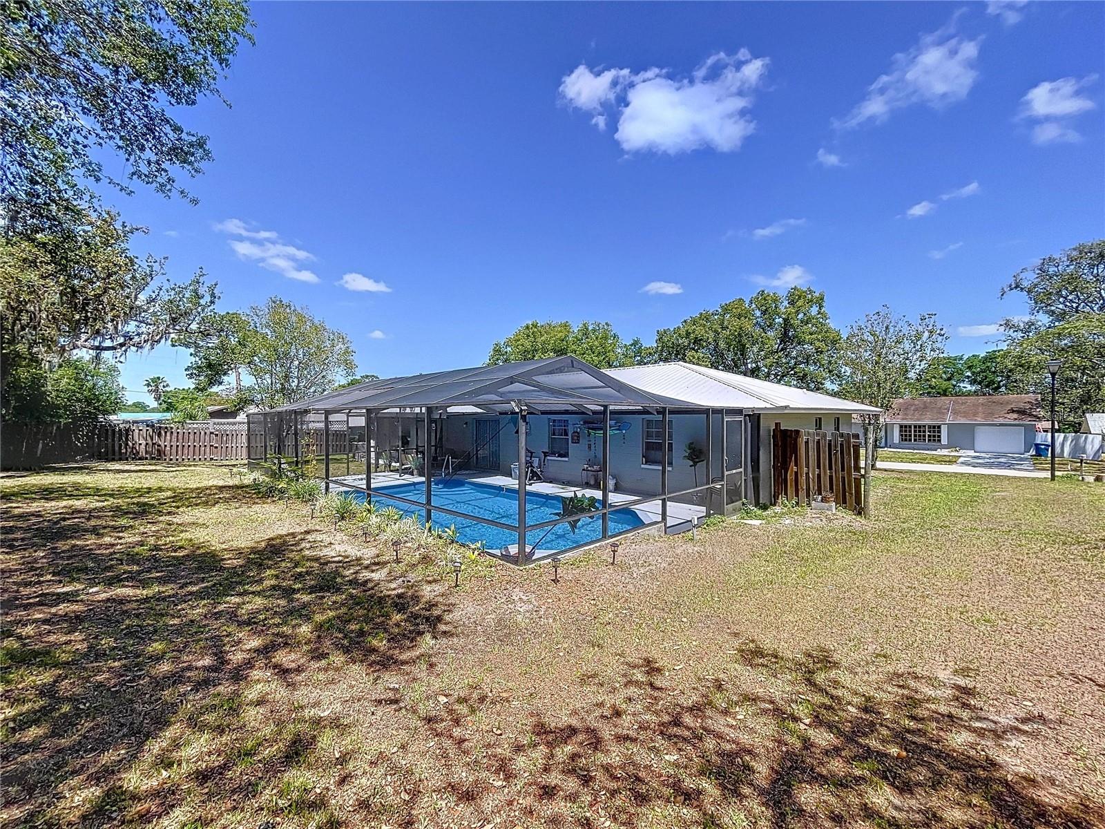Brooksville pool home with plenty of yard space for outdoor activities or your family pets.