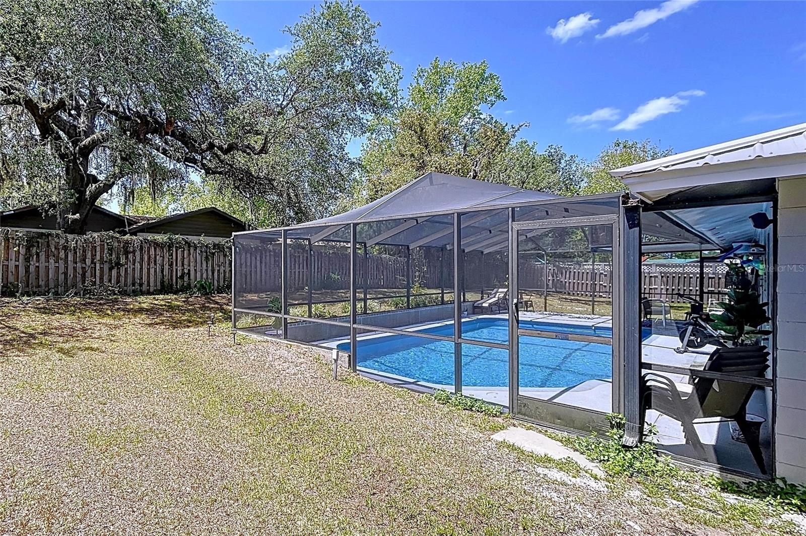 Brooksville pool home with plenty of yard space for outdoor activities or your family pets.