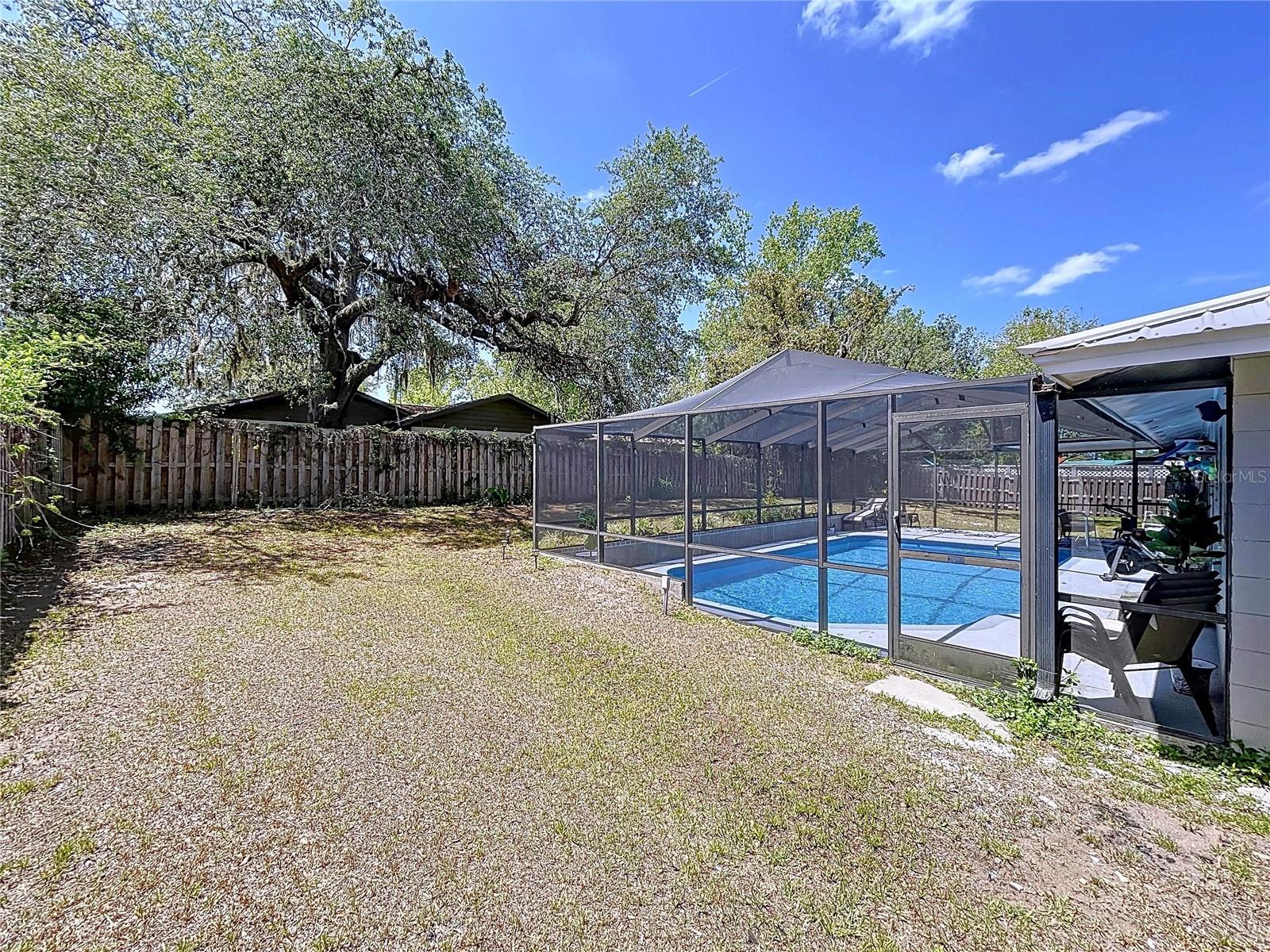 Brooksville pool home with plenty of yard space for outdoor activities or your family pets.