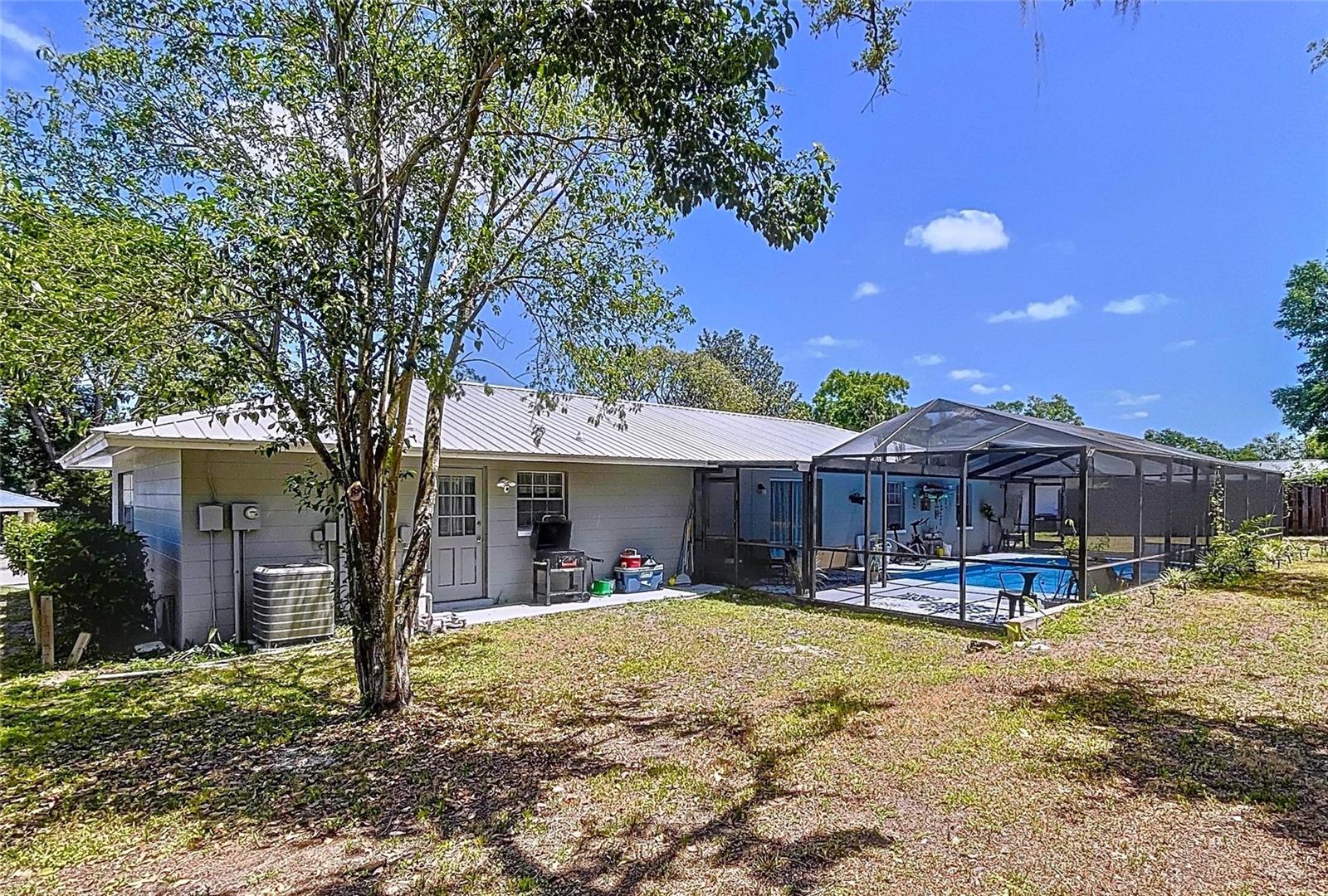 Brooksville pool home with plenty of yard space for outdoor activities or your family pets.