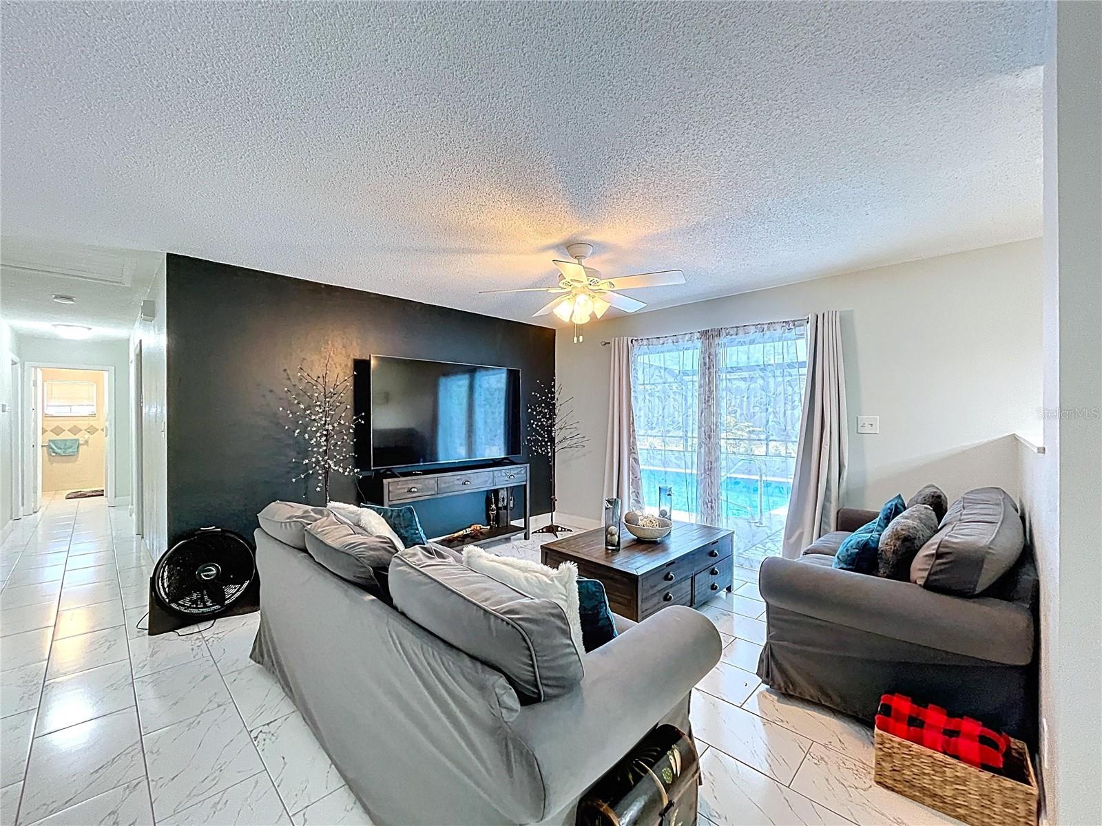 Spacious and nicely appointed living room.