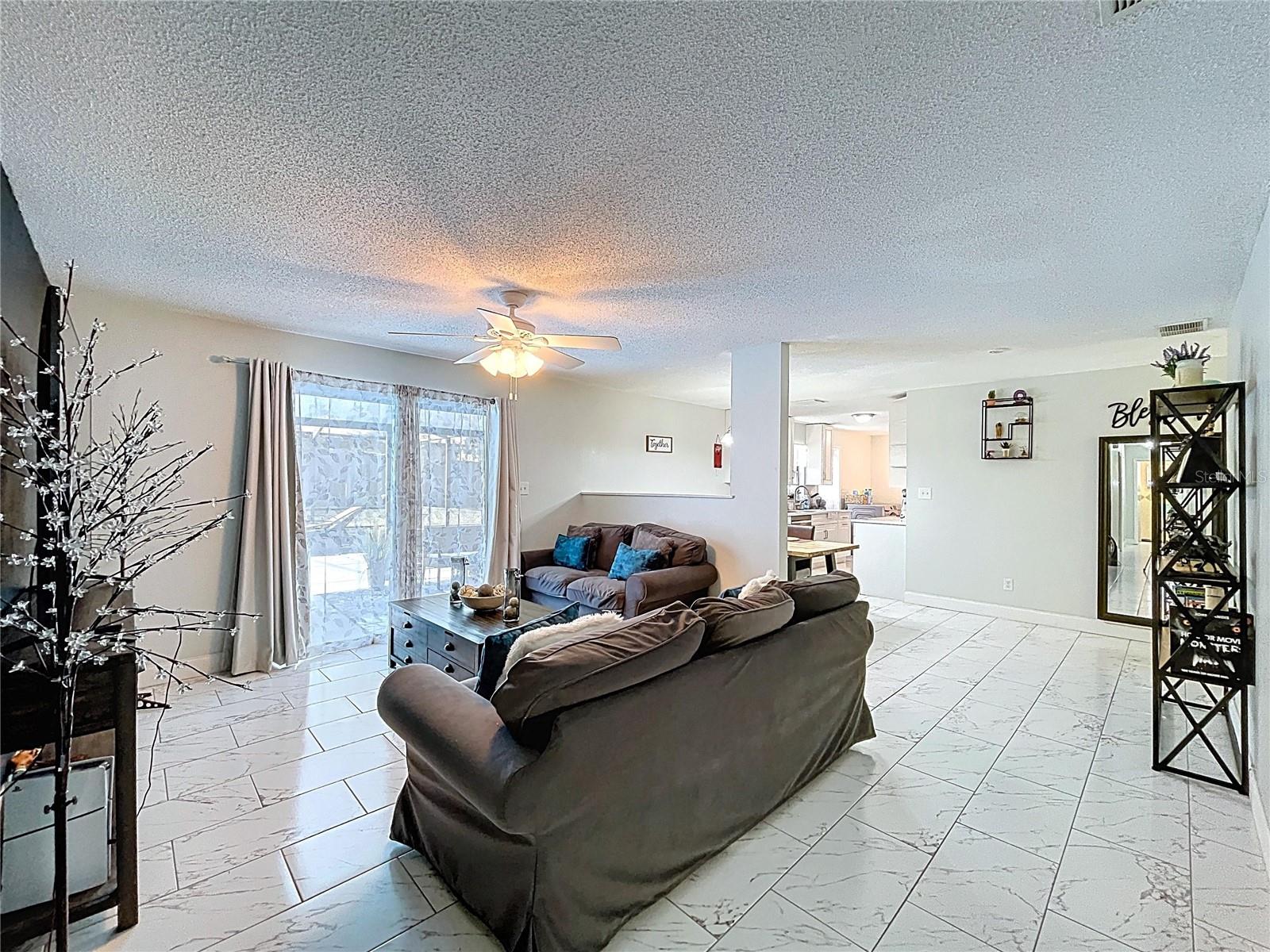 Ample natural lighting bounces off newer ceramic tile flooring.
