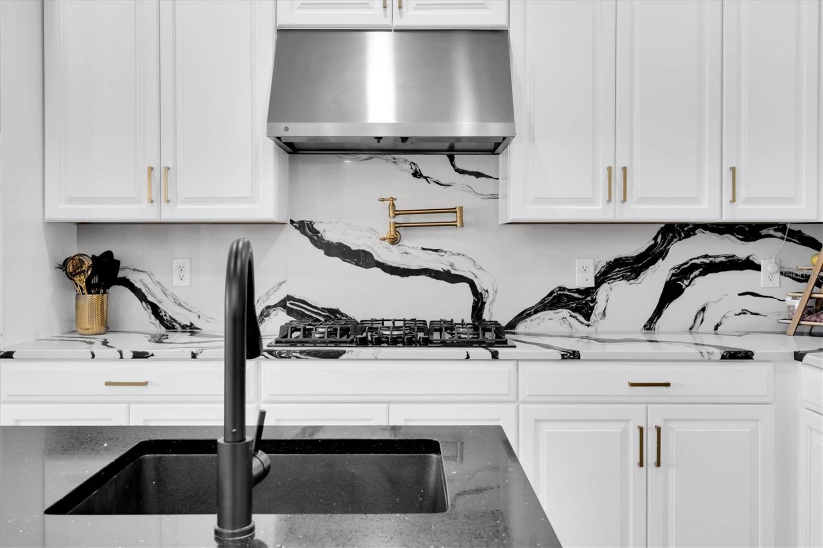 Range Hood, Pot Filler w/ Cabria Quartz Backsplash