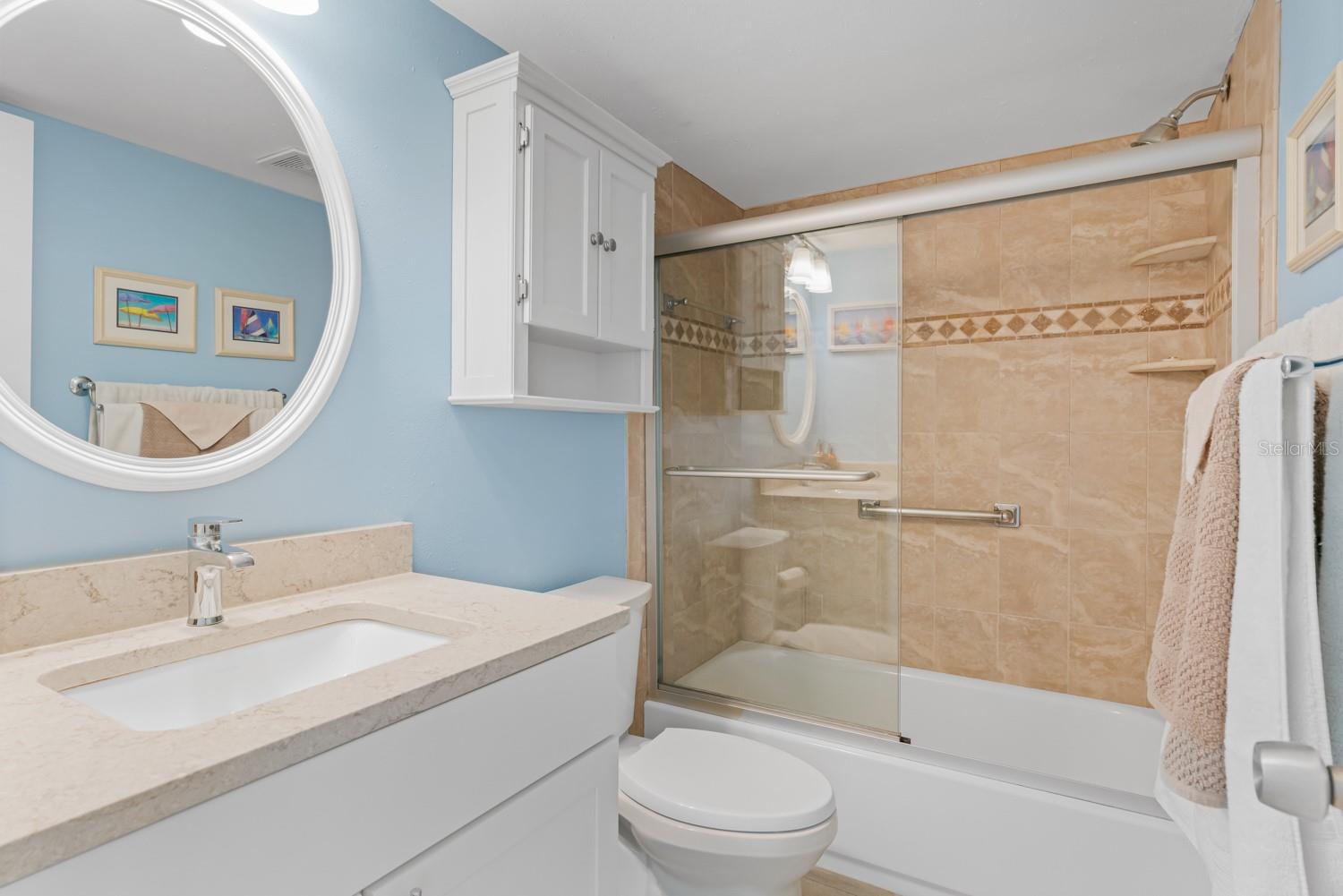 Bathroom 1 with tub and shower combo and sliding doors