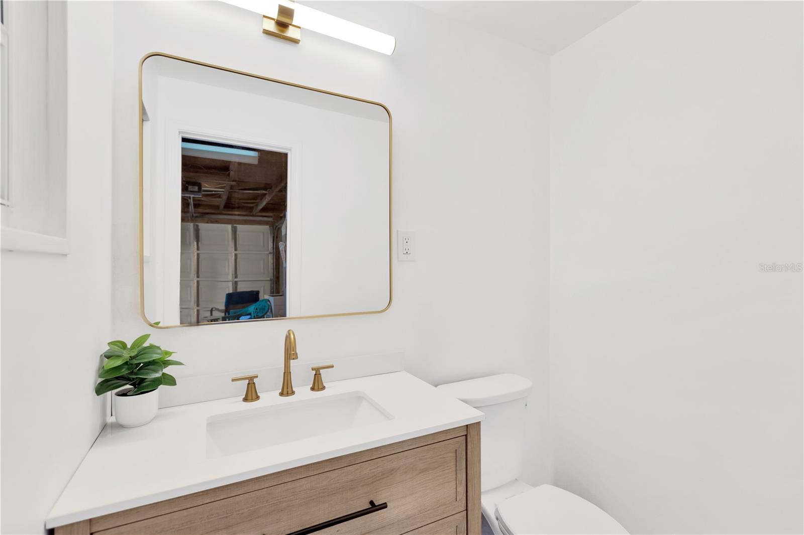 Trendy Half Bath located in garage for convenience