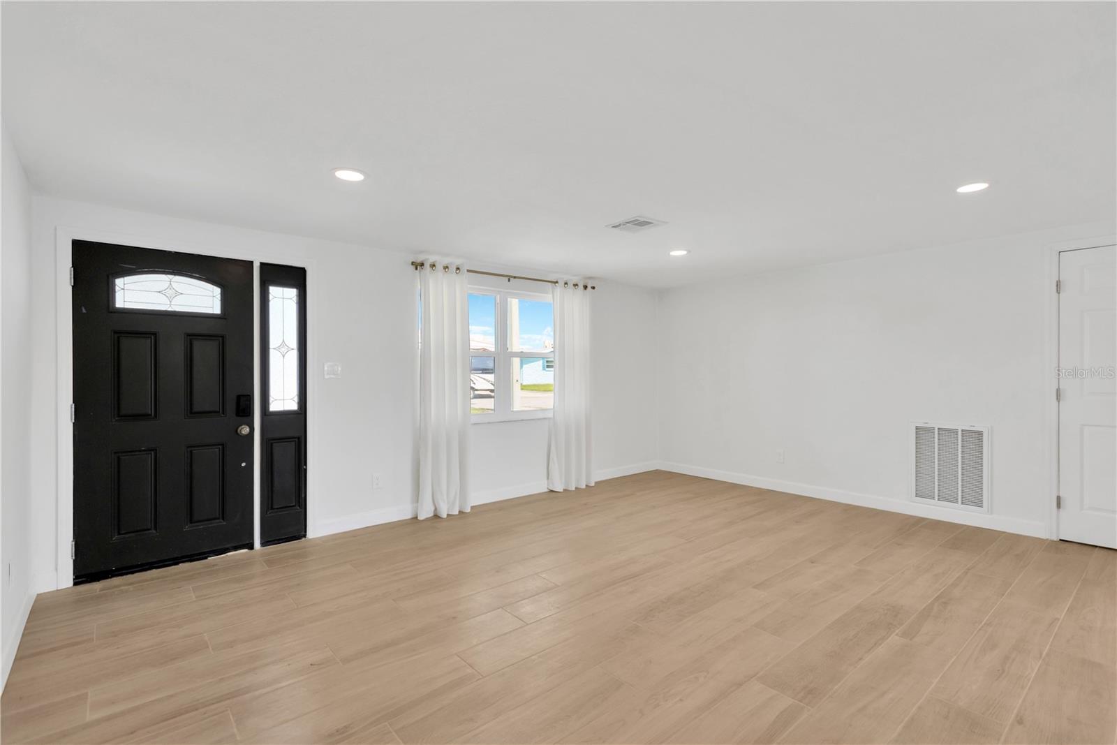 Step into this amazing Great Room w/picture window.  New ceramic tile plank flooring throughout.