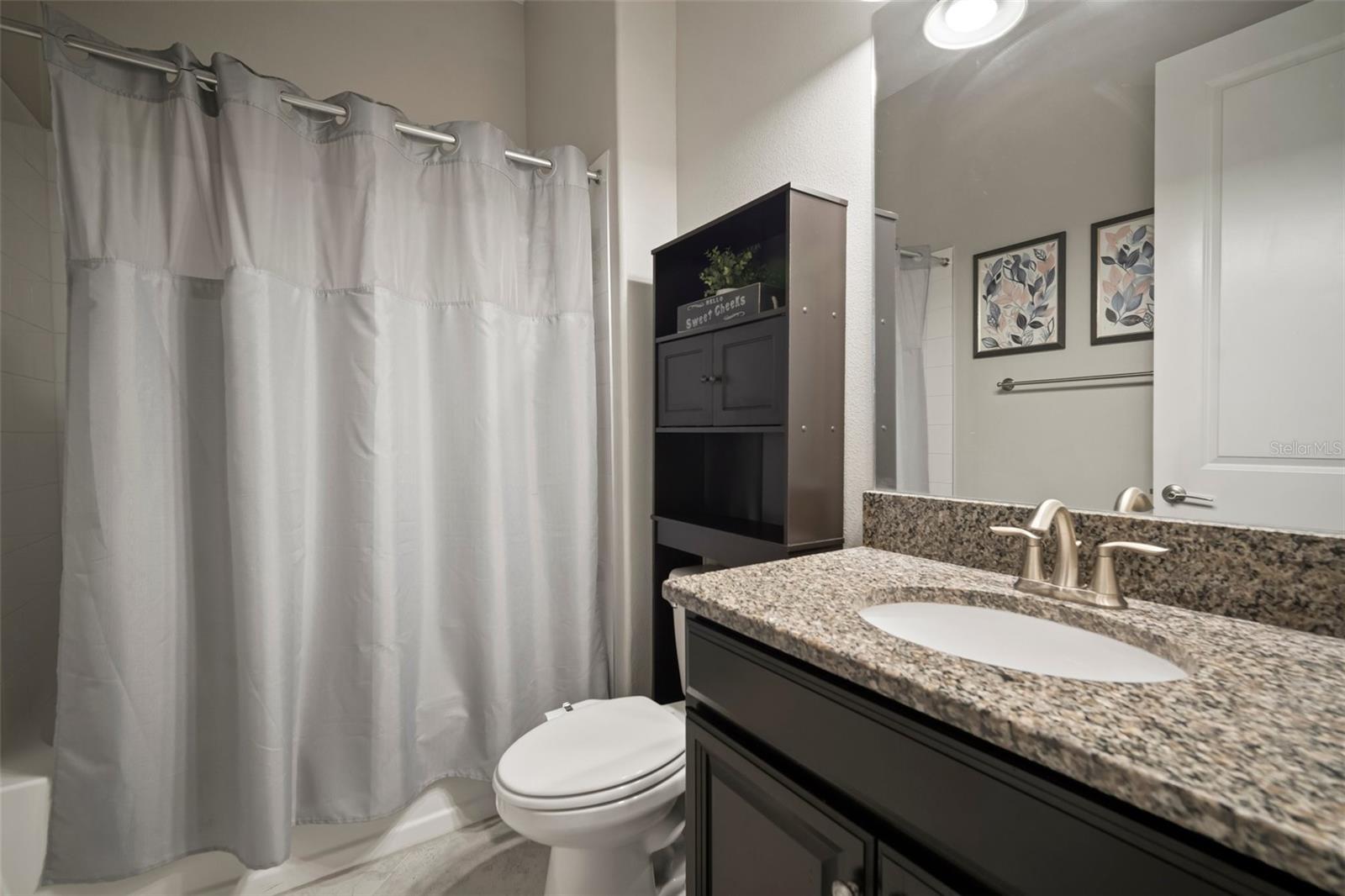 Downstairs full bath with shower/tub combination