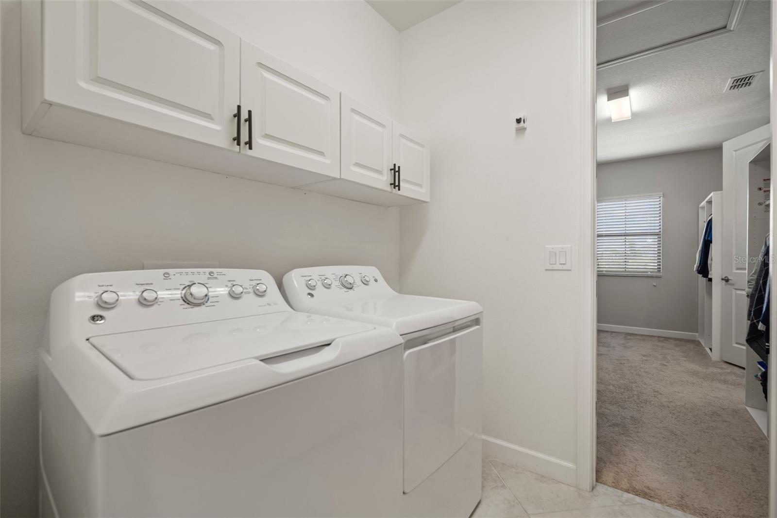 Upstairs laundry room connected to primary closet